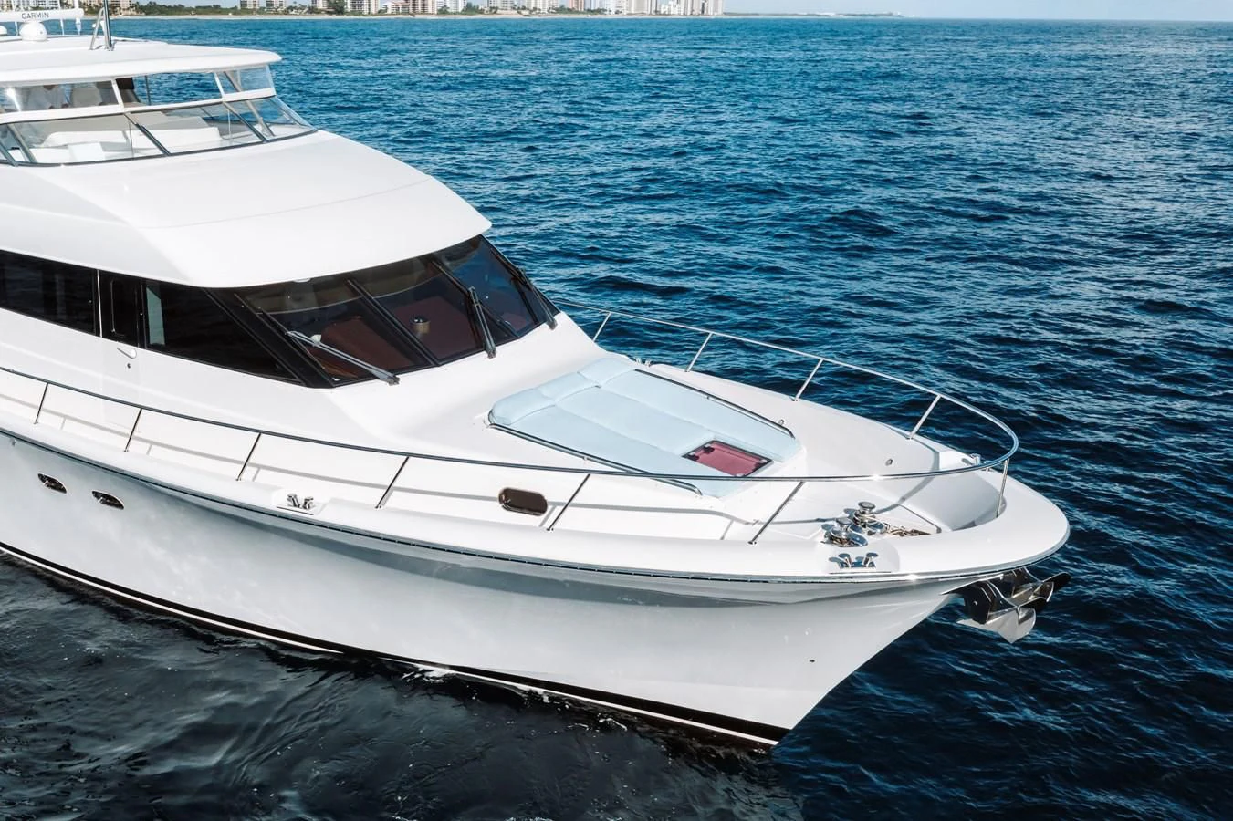a white boat in the water aboard FINAL FINAL Yacht for Sale
