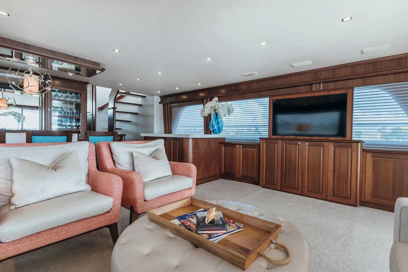 a living room with a tv and furniture aboard FINAL FINAL Yacht for Sale