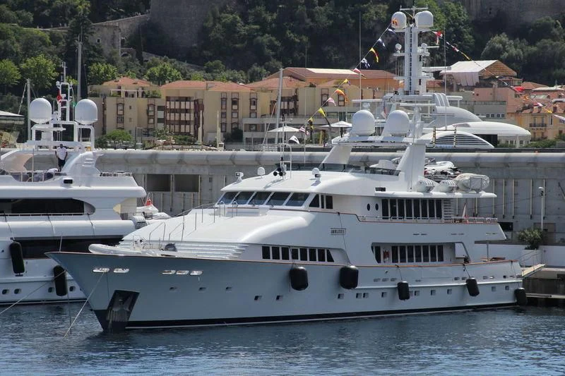 a group of boats in a harbor aboard AMORAZUR II Yacht for Sale