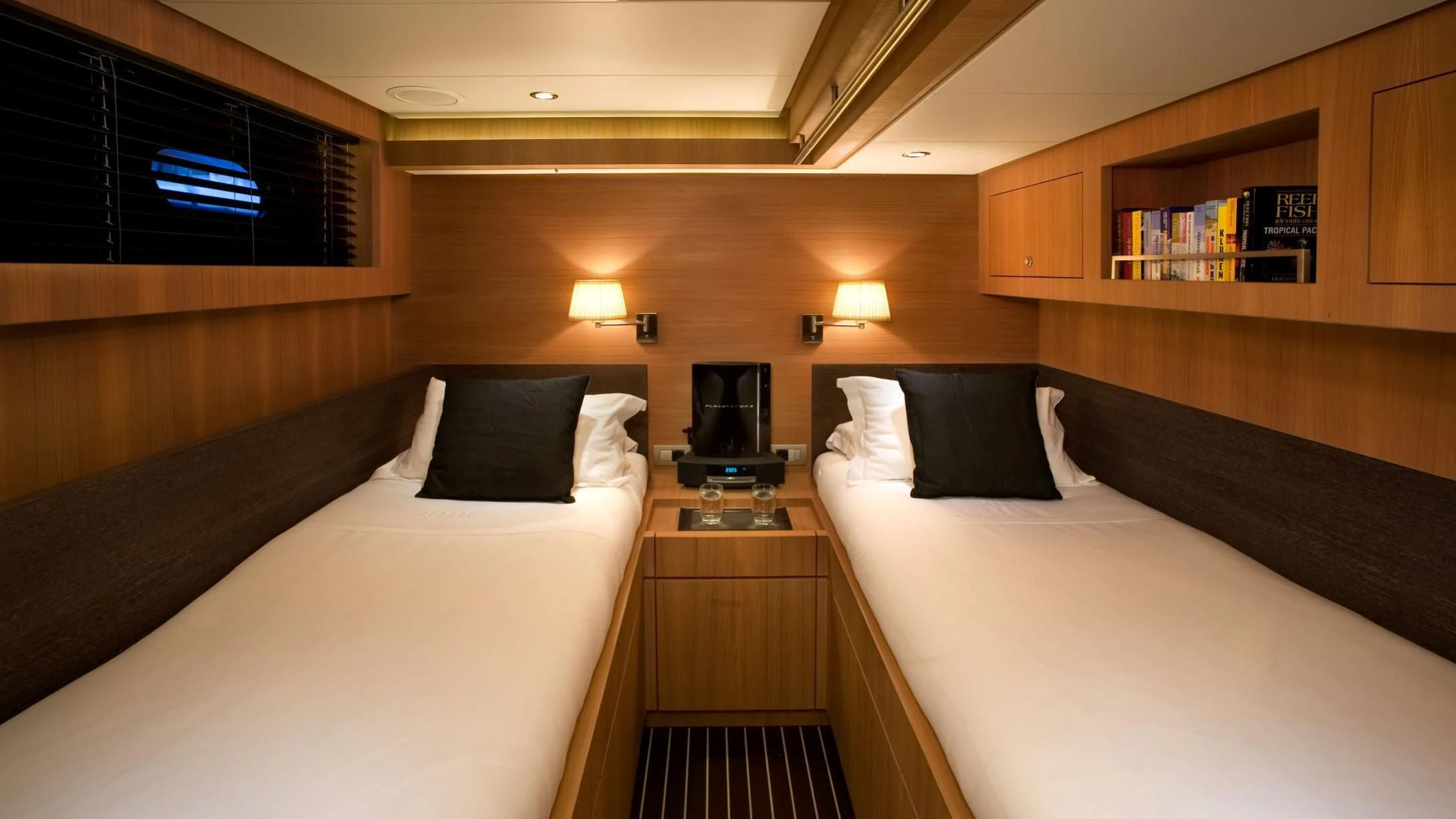 a room with two beds aboard ICARUS Yacht for Sale