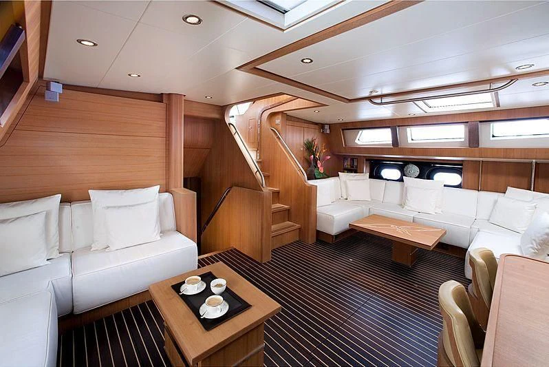 a living room with a staircase aboard ICARUS Yacht for Sale