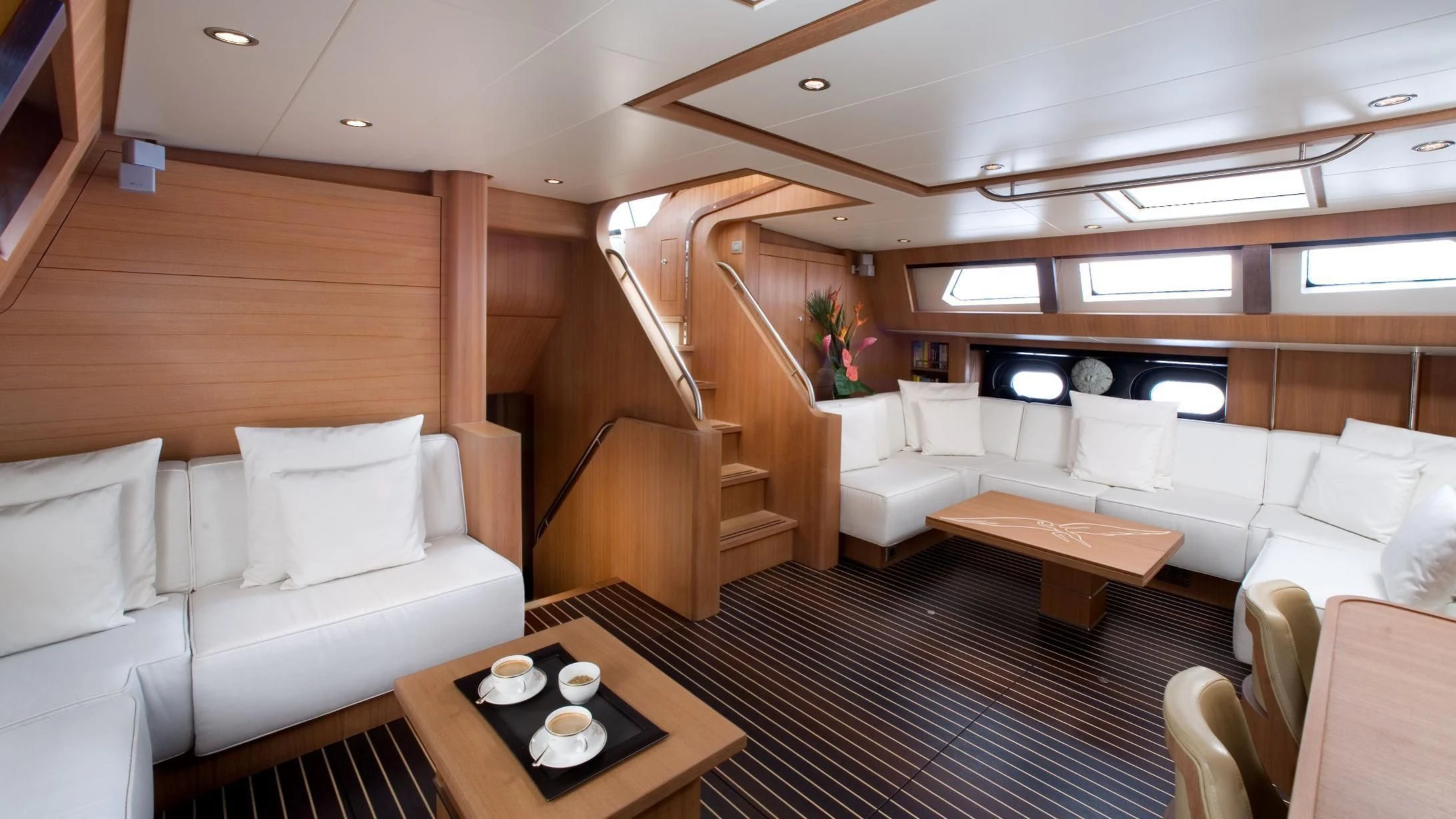 a living room with a couch and a table aboard ICARUS Yacht for Sale
