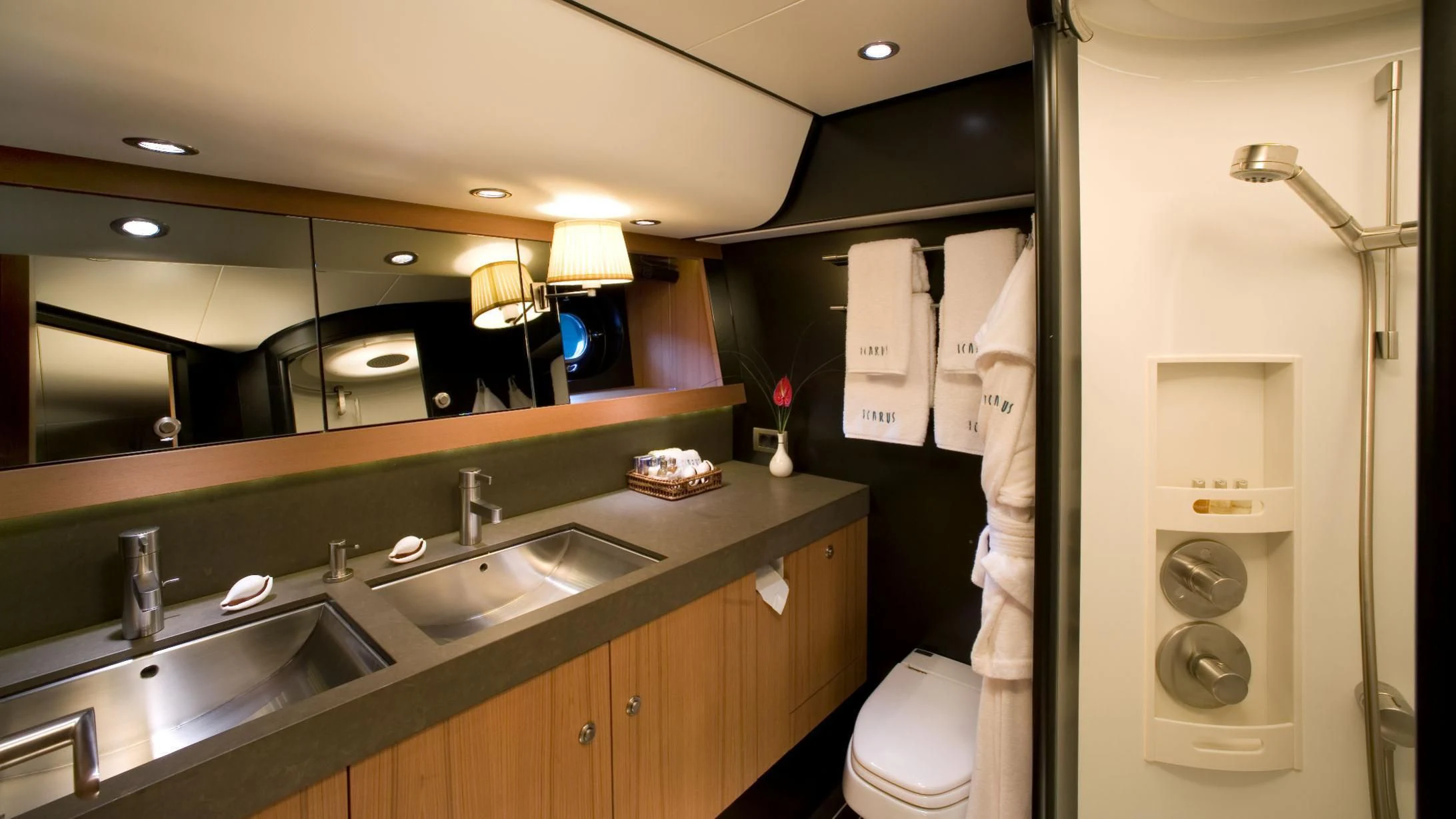 a bathroom with a sink and a mirror aboard ICARUS Yacht for Sale