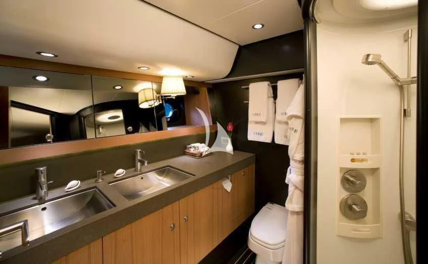 a bathroom with a sink and a mirror aboard ICARUS Yacht for Sale