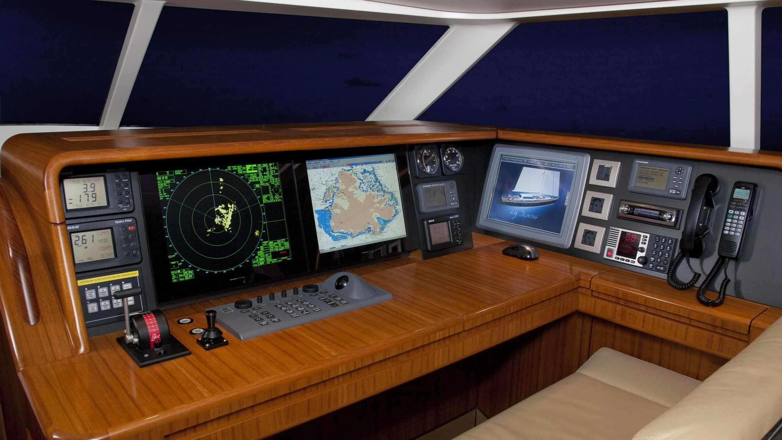a control panel with a variety of electronic devices on it aboard ICARUS Yacht for Sale