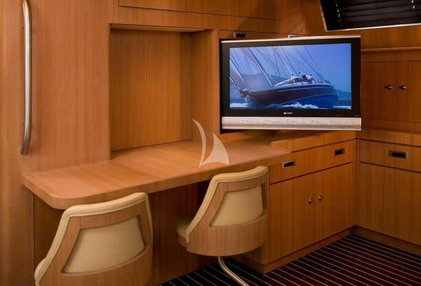 a tv on a table aboard ICARUS Yacht for Sale