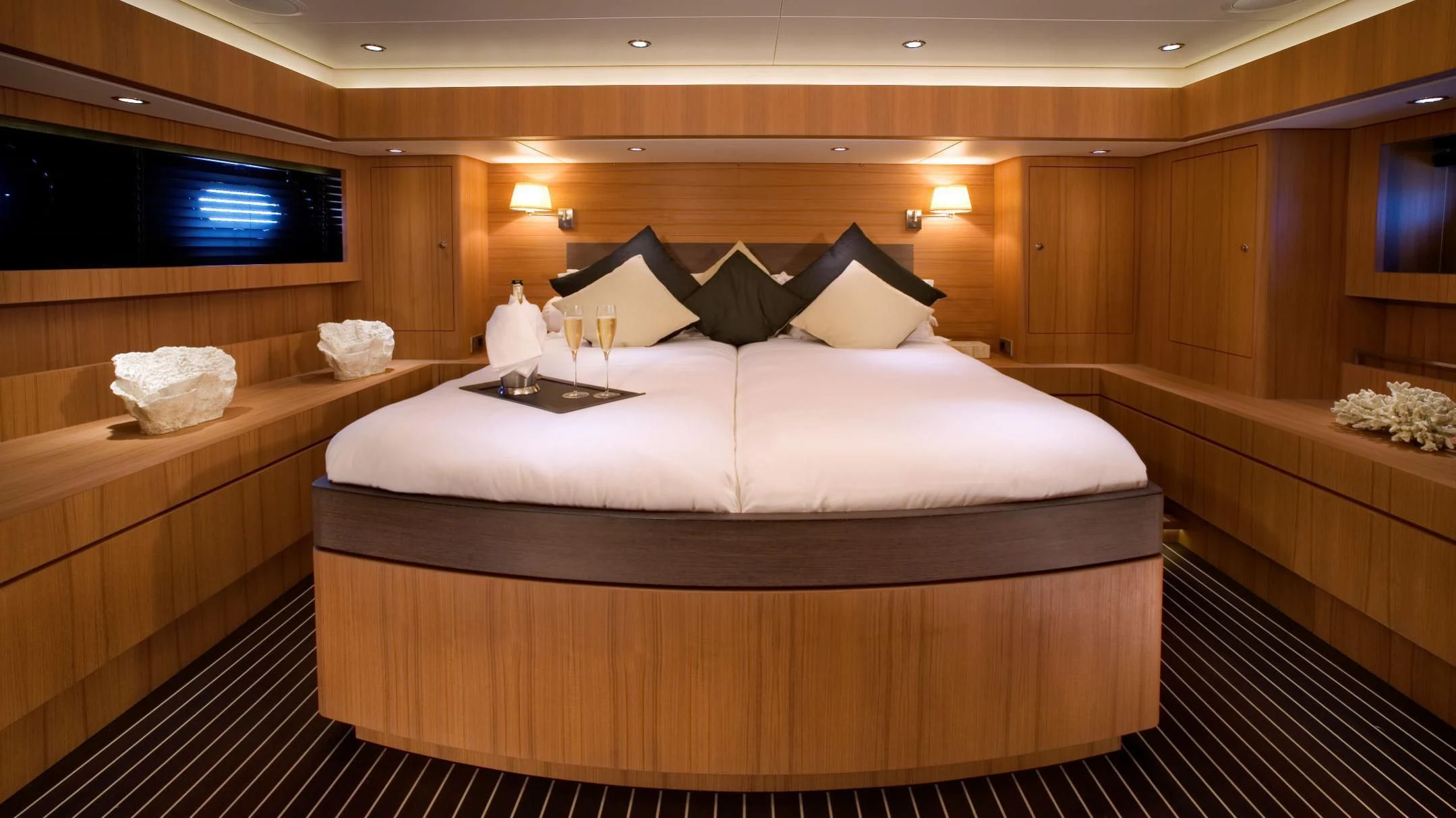 a bed in a room aboard ICARUS Yacht for Sale