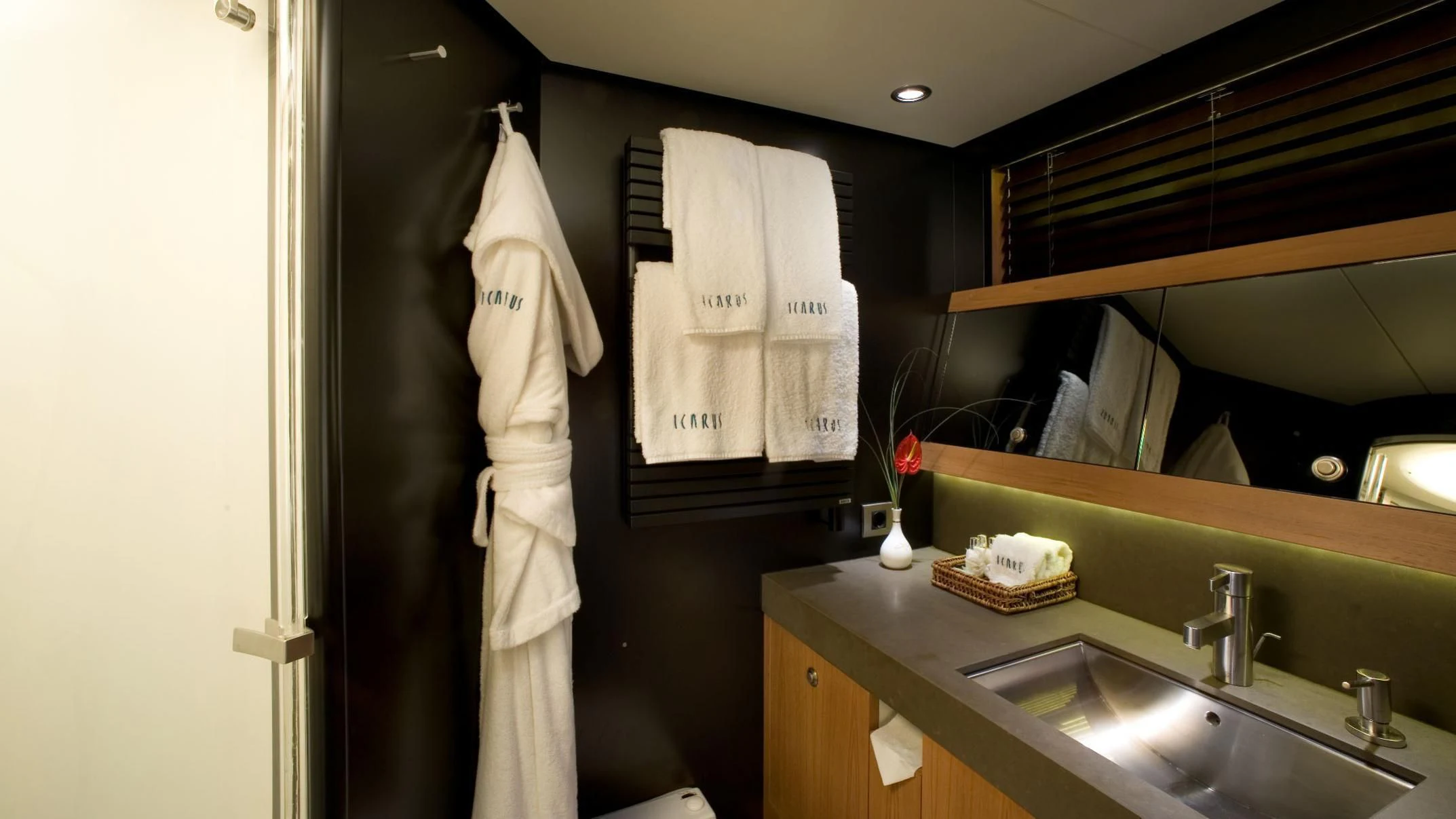 a bathroom with a sink and towels aboard ICARUS Yacht for Sale