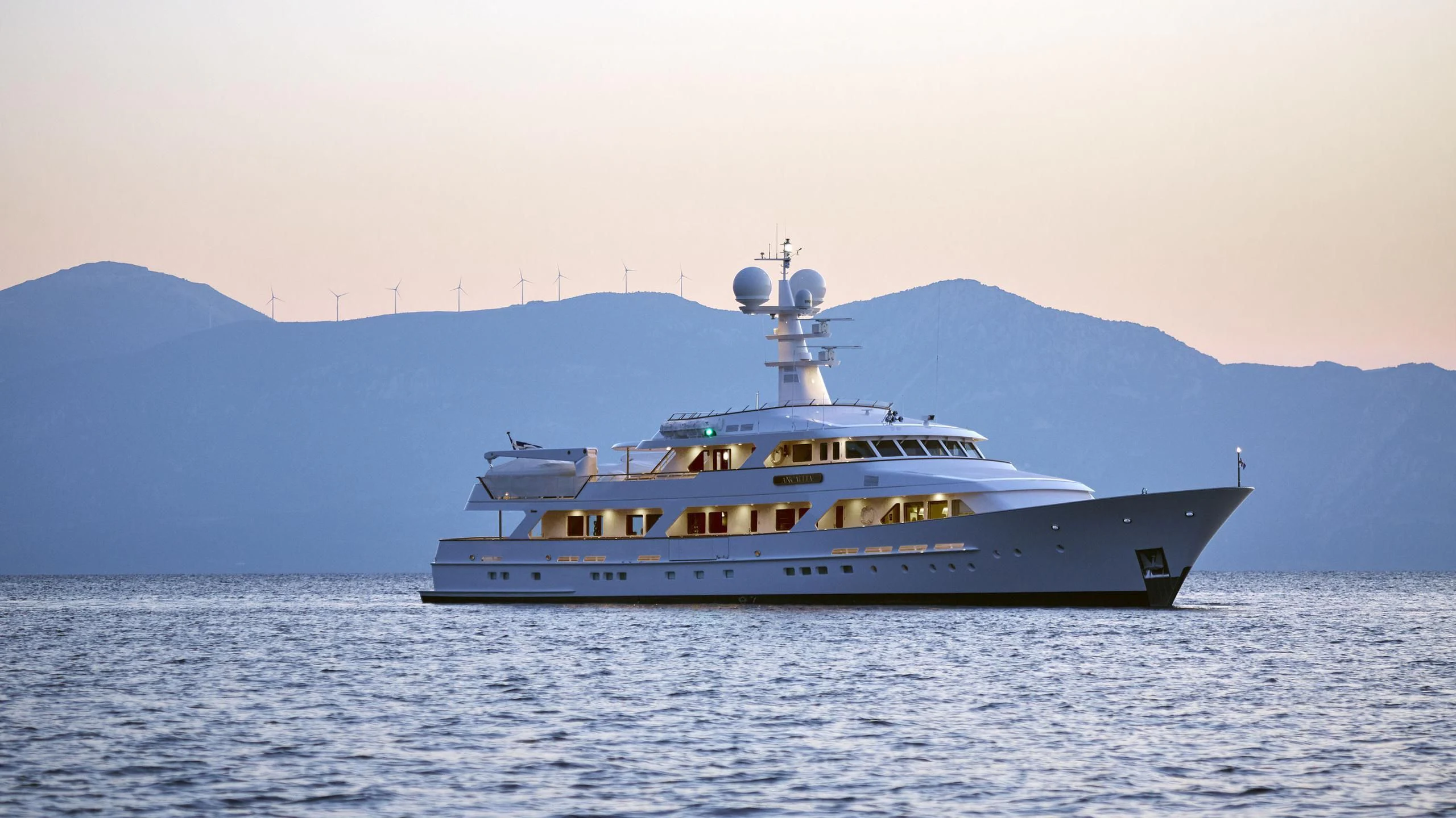 a large ship in the water aboard ANCALLIA Yacht for Sale