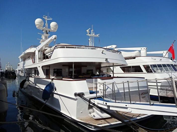 a couple of boats are parked in a harbor aboard ANCALLIA Yacht for Sale