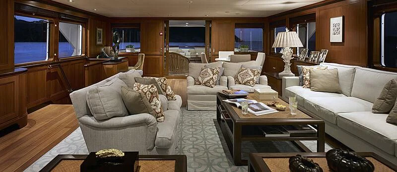 a living room with a couch and a coffee table aboard ANCALLIA Yacht for Sale