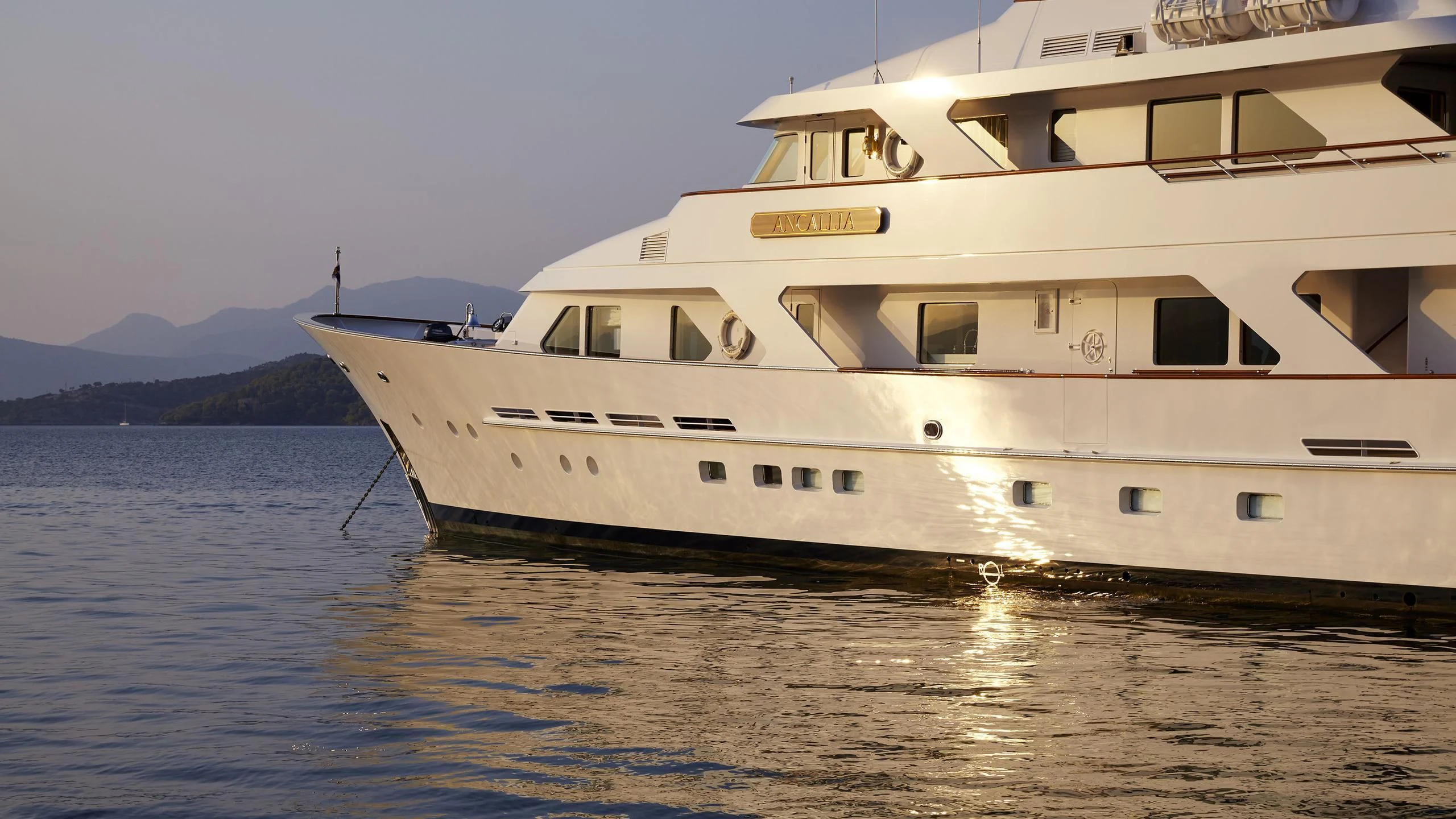 a large white boat in the water aboard ANCALLIA Yacht for Sale