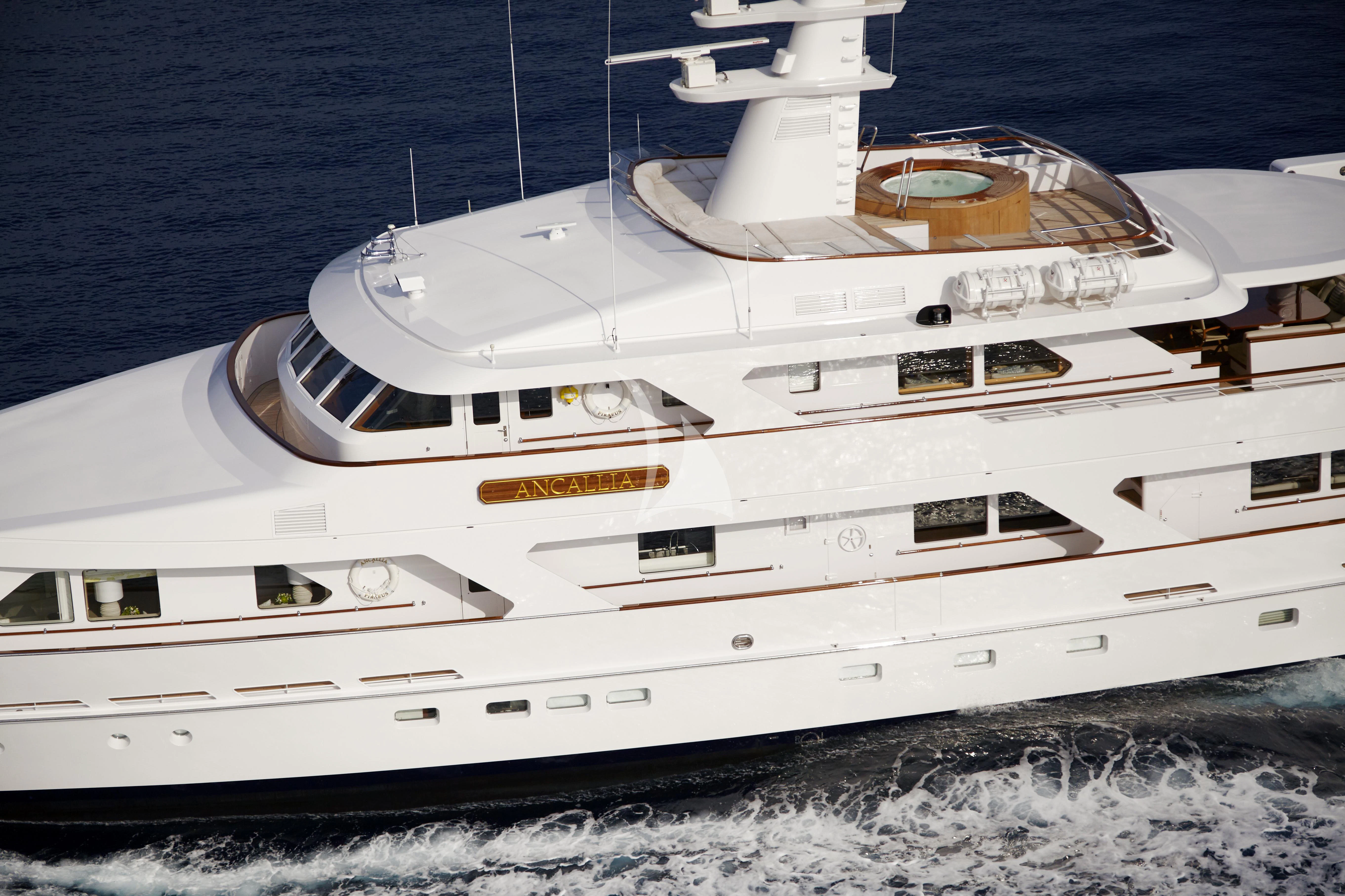 a white yacht on the beach aboard ANCALLIA Yacht for Sale