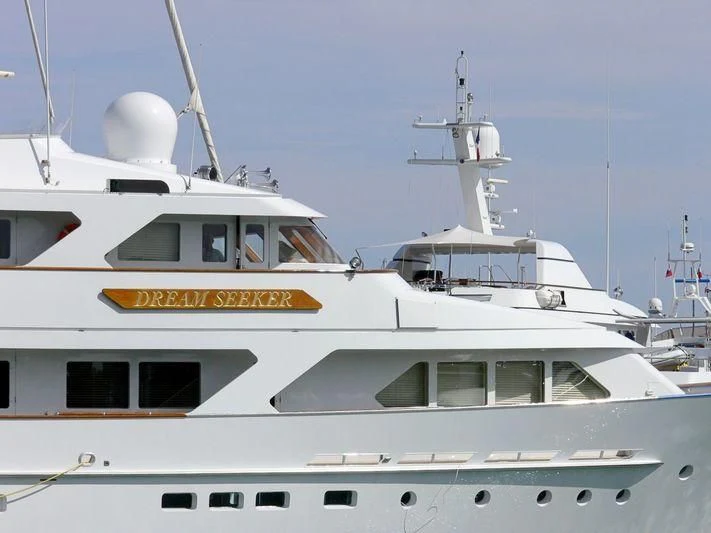 a white boat with a yellow sign on it aboard ANCALLIA Yacht for Sale