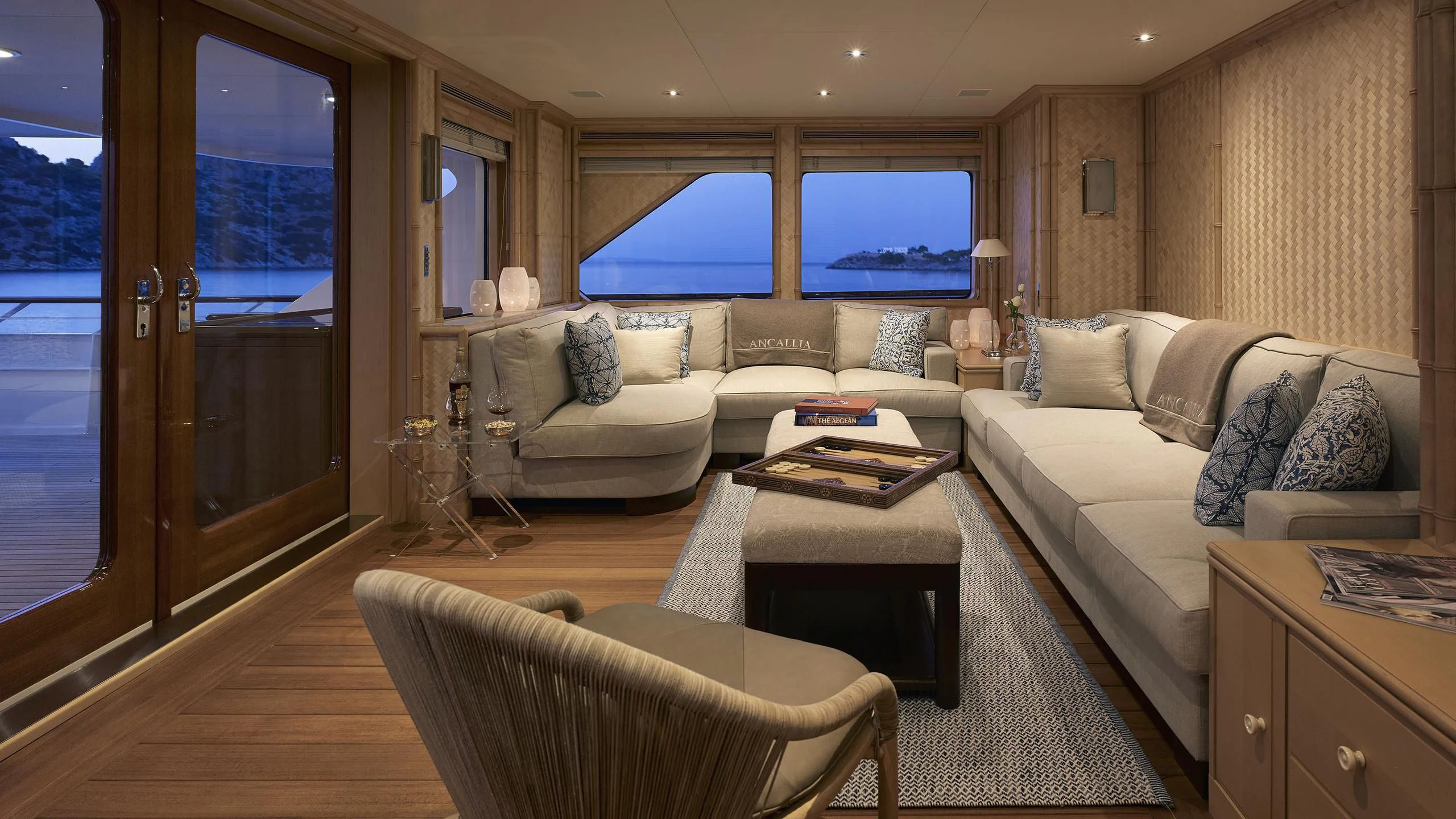 a living room with a couch and a table aboard ANCALLIA Yacht for Sale