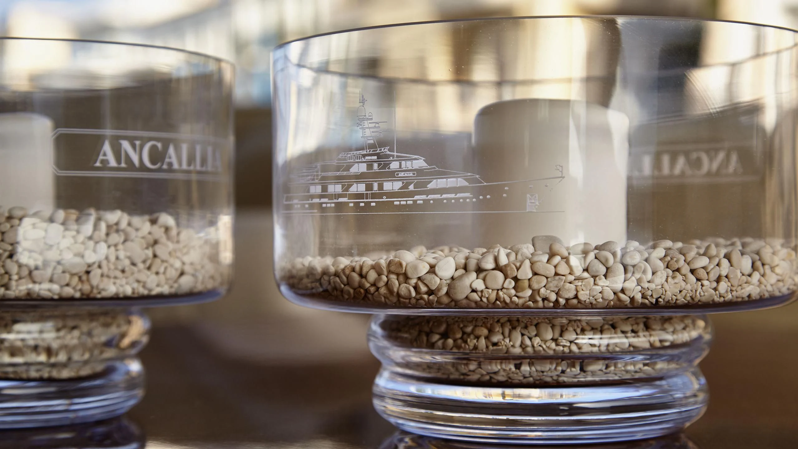 a glass jar with white and gold objects in it aboard ANCALLIA Yacht for Sale