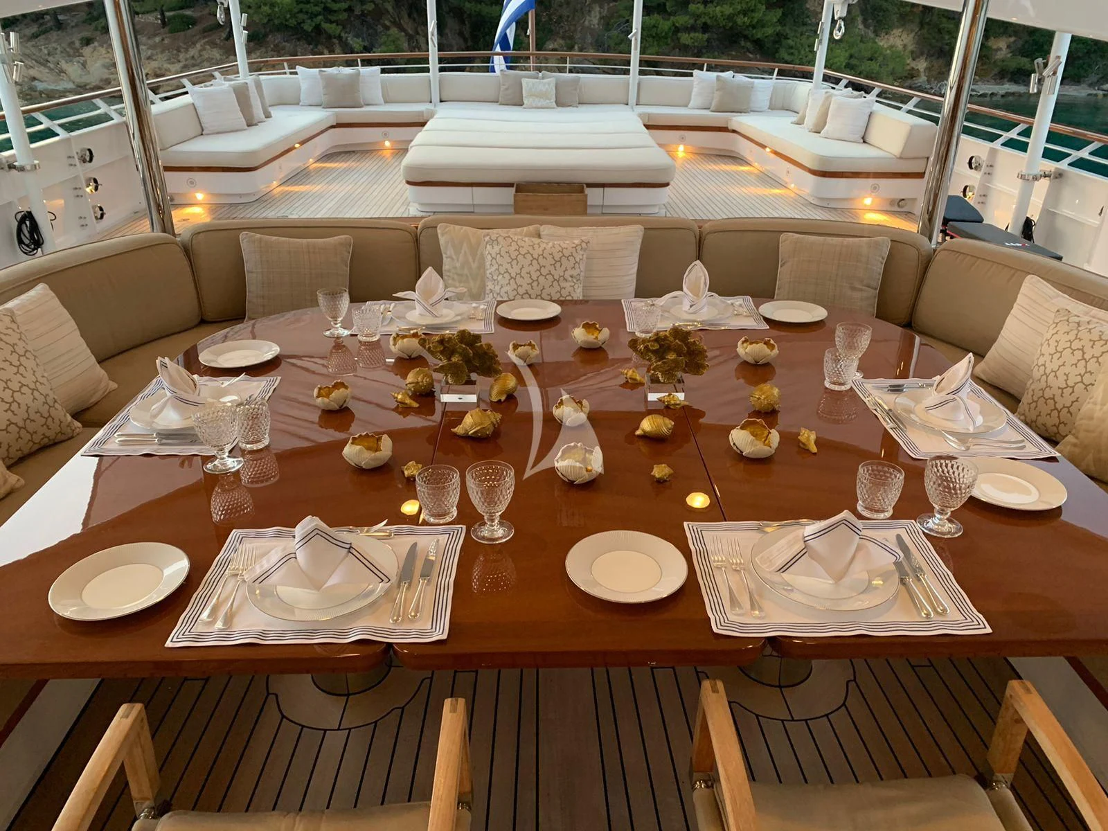 a table with plates and glasses aboard ANCALLIA Yacht for Sale