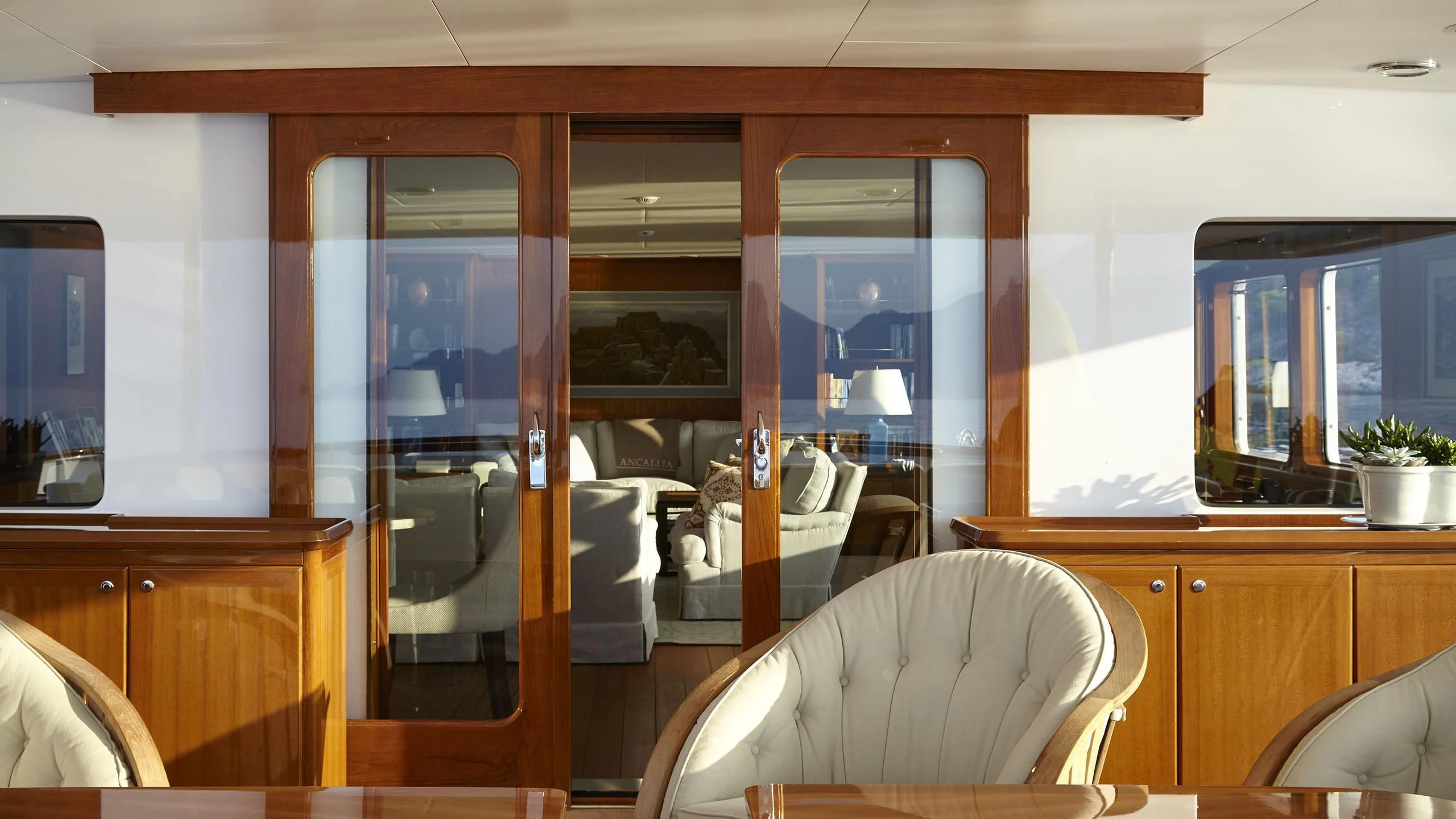 a room with a table and chairs aboard ANCALLIA Yacht for Sale