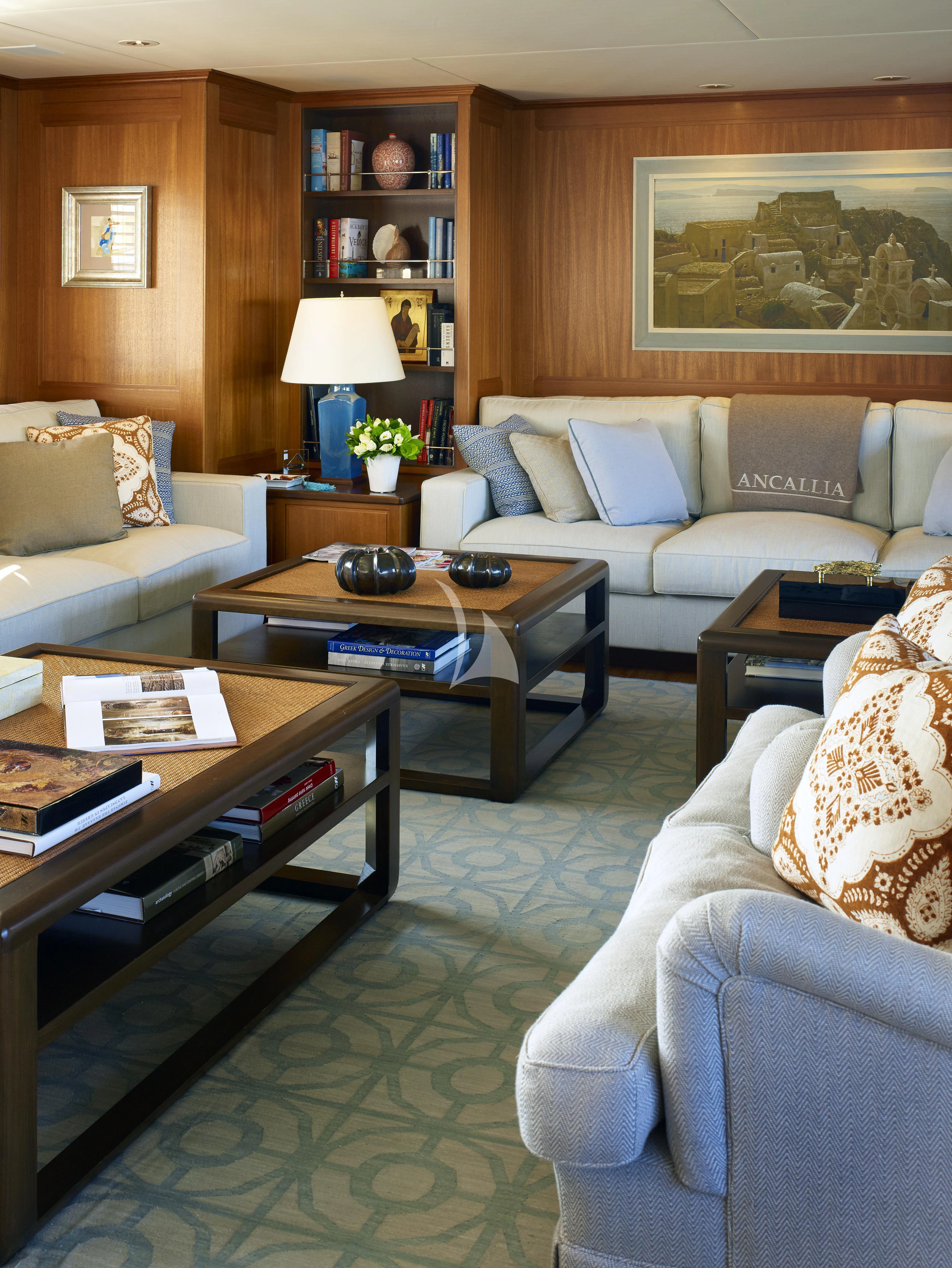 a living room with a couch and a coffee table aboard ANCALLIA Yacht for Sale