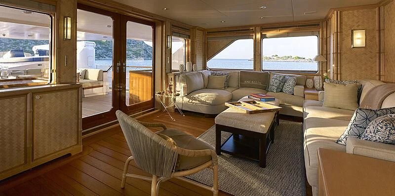 a living room with a couch and a coffee table aboard ANCALLIA Yacht for Sale