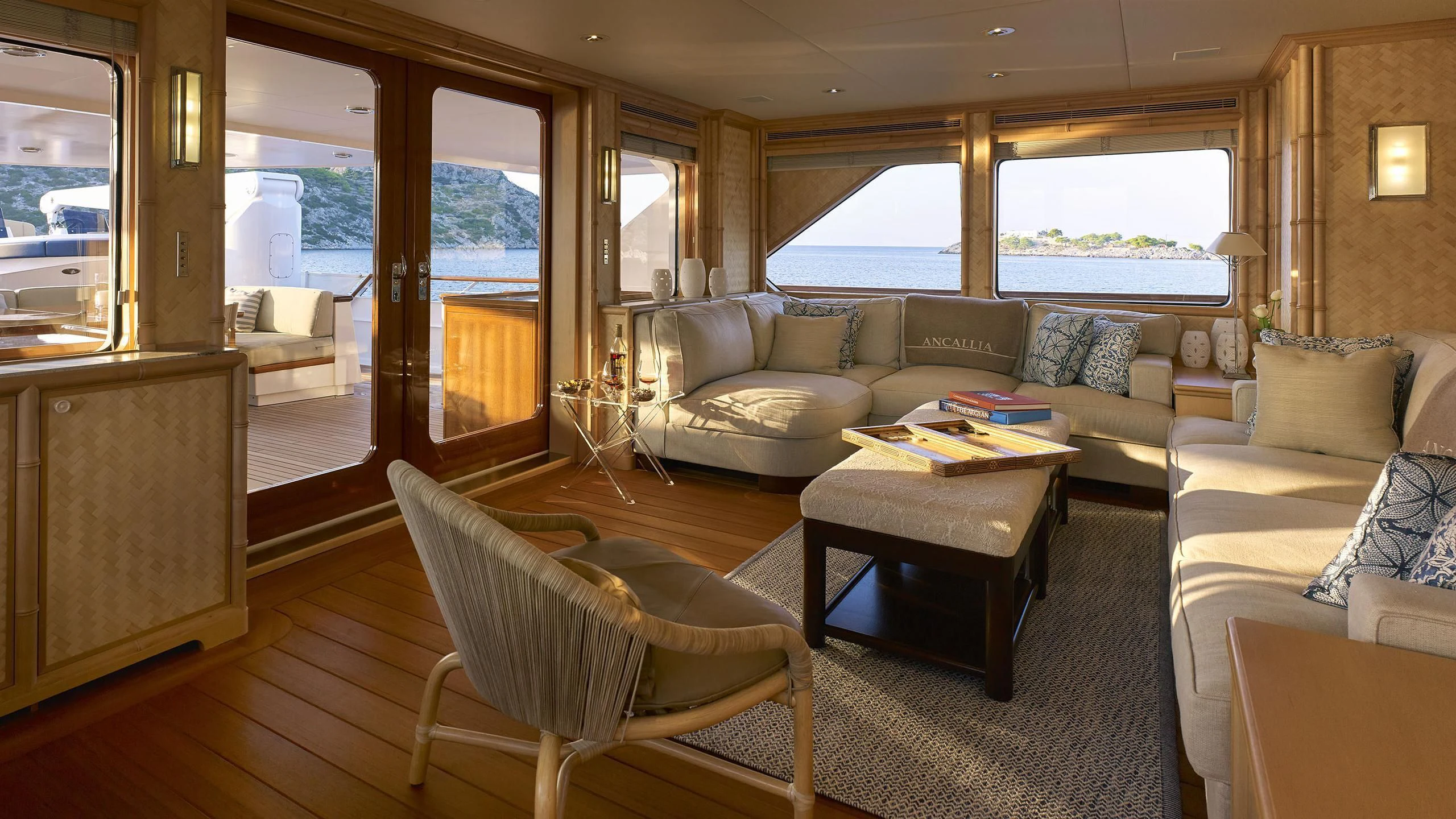 a living room with a couch and a coffee table aboard ANCALLIA Yacht for Sale