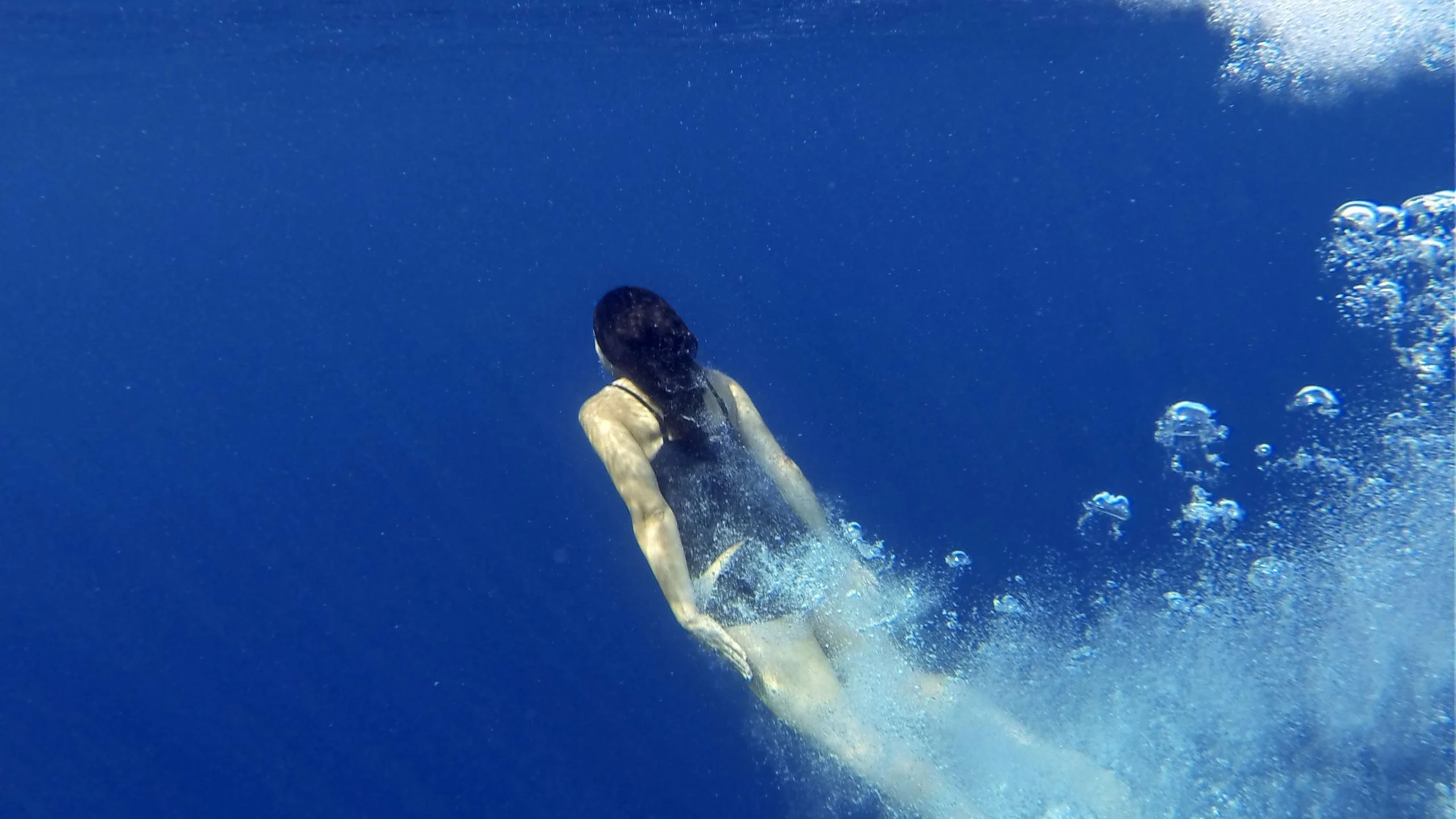 a person swimming in the water aboard ANCALLIA Yacht for Sale
