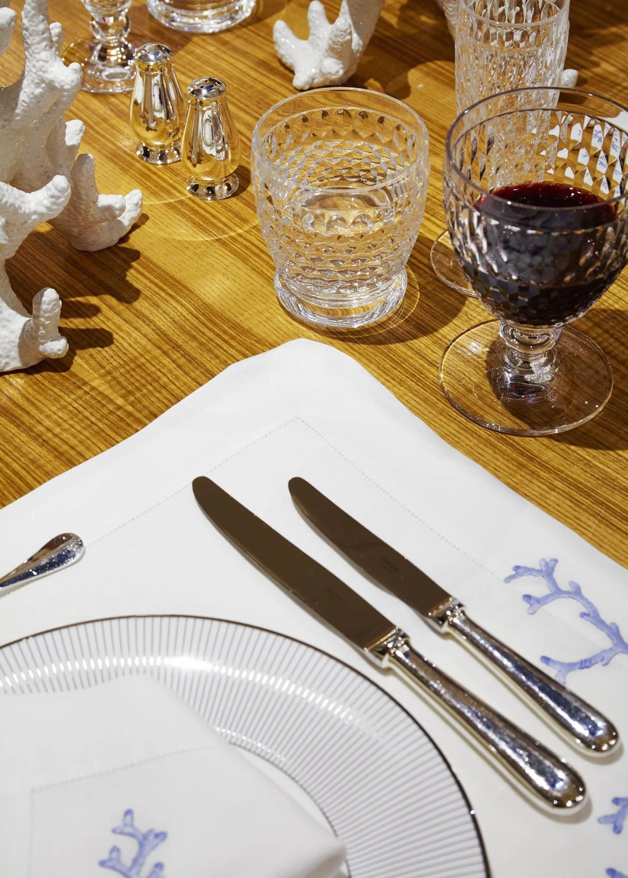 a table with plates and glasses aboard ANCALLIA Yacht for Sale