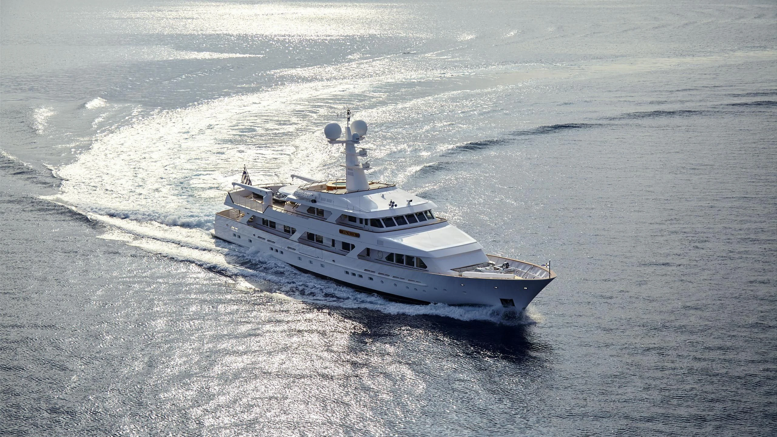 a white yacht in the ocean aboard ANCALLIA Yacht for Sale