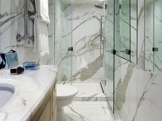 a bathroom with a shower and sink aboard ANCALLIA Yacht for Sale