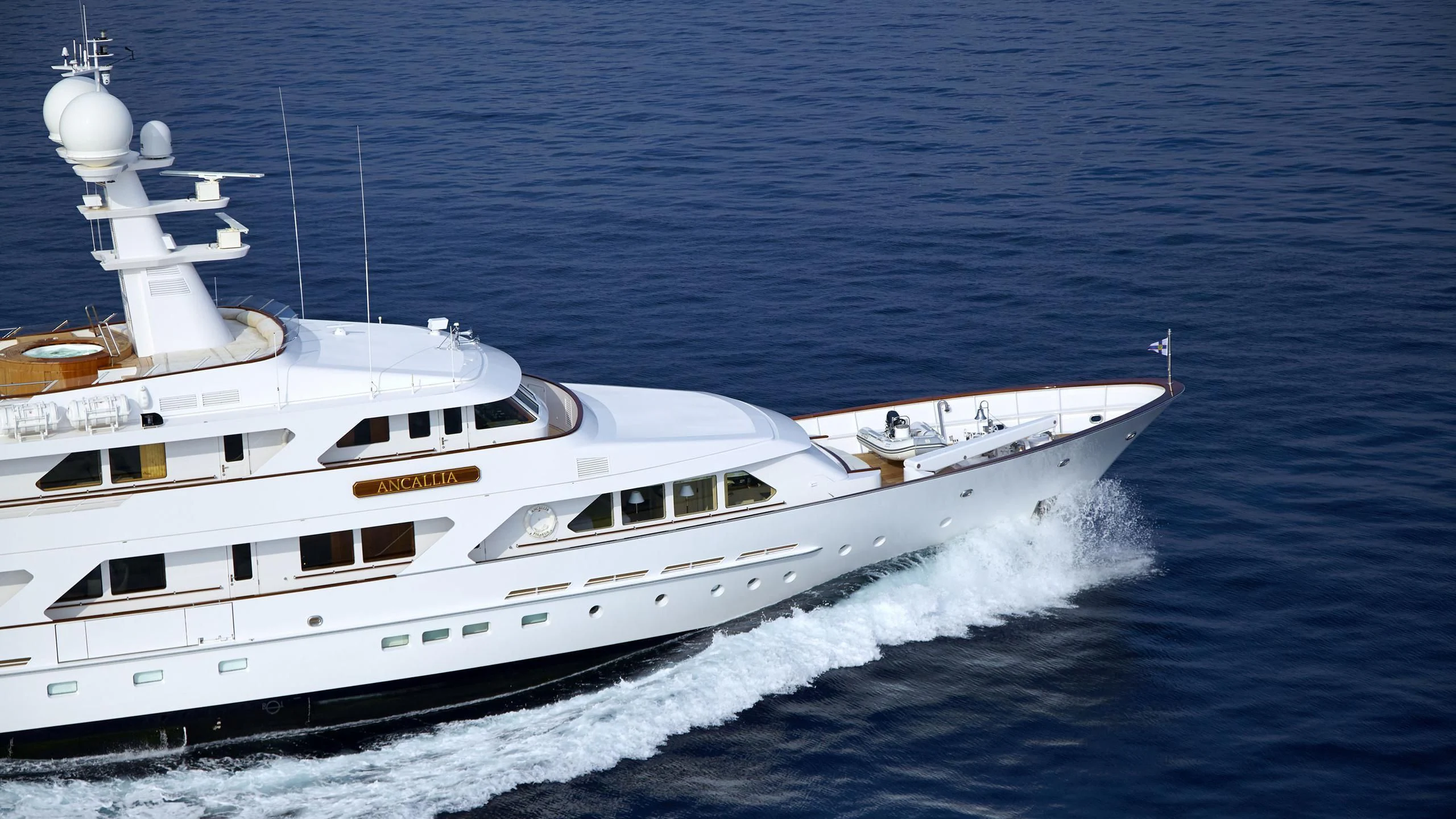 a white yacht on the water aboard ANCALLIA Yacht for Sale