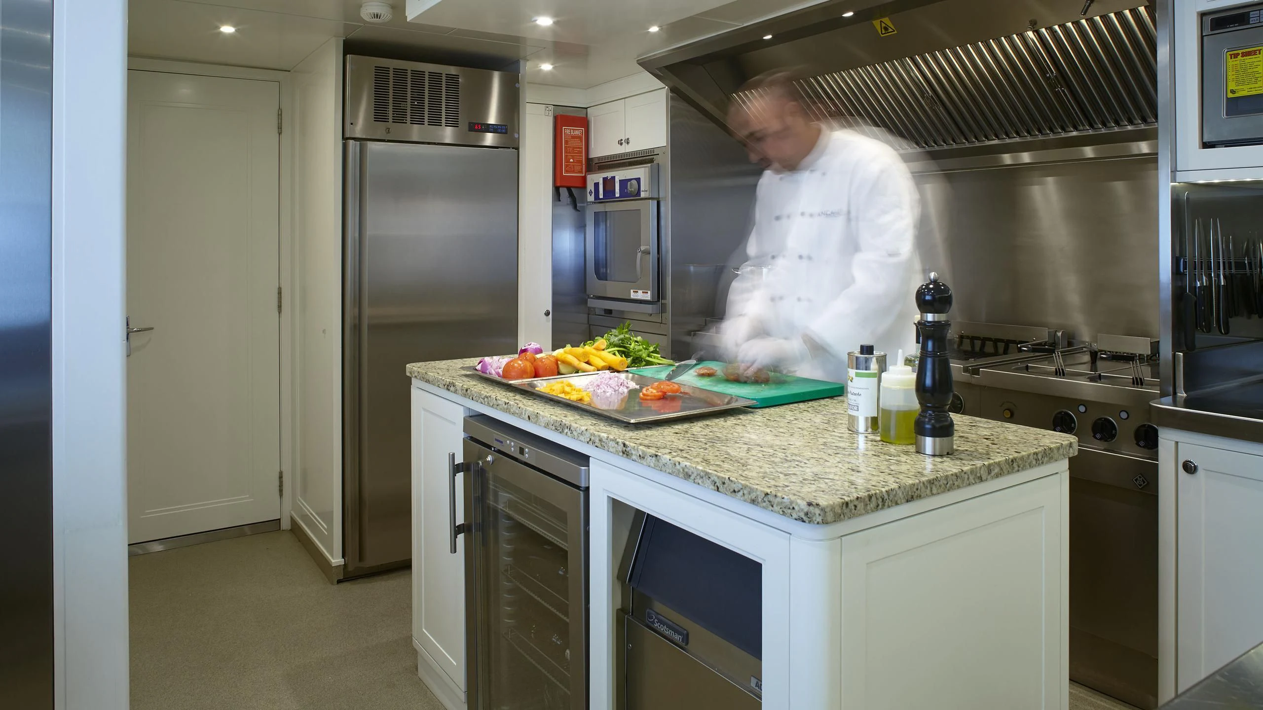 a chef in a kitchen aboard ANCALLIA Yacht for Sale