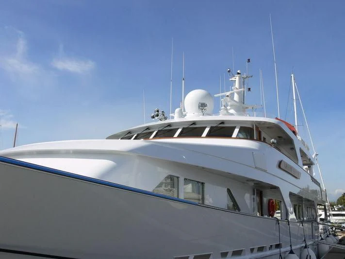 a white yacht on the water aboard ANCALLIA Yacht for Sale