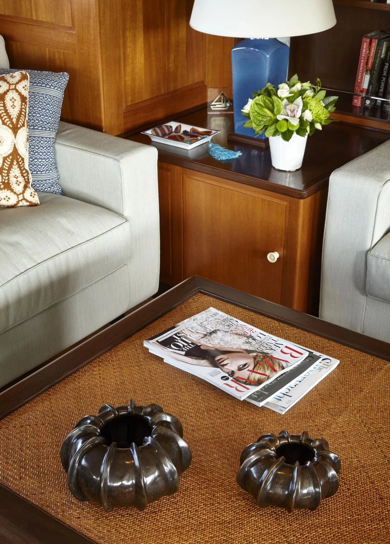 a coffee table with a book and a flower on it aboard ANCALLIA Yacht for Sale