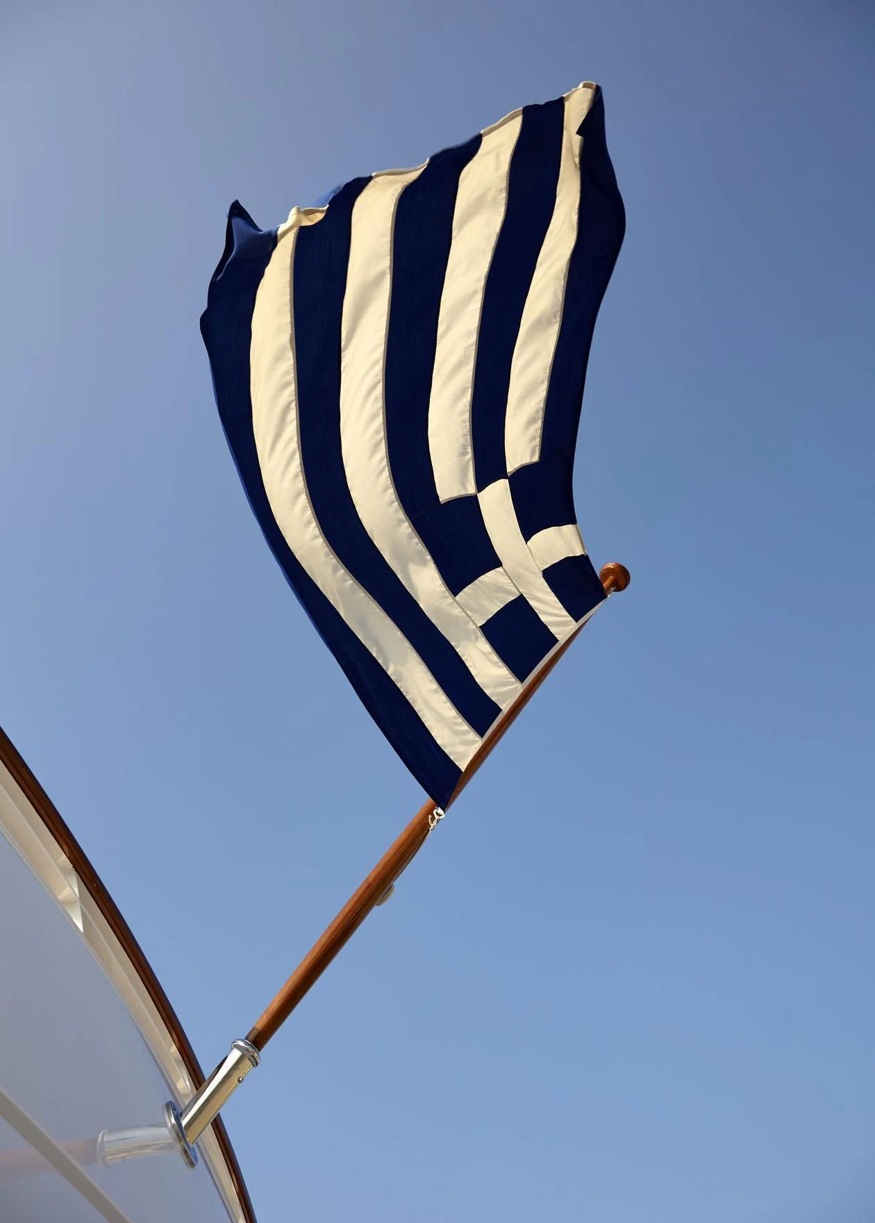 a flag on a pole aboard ANCALLIA Yacht for Sale