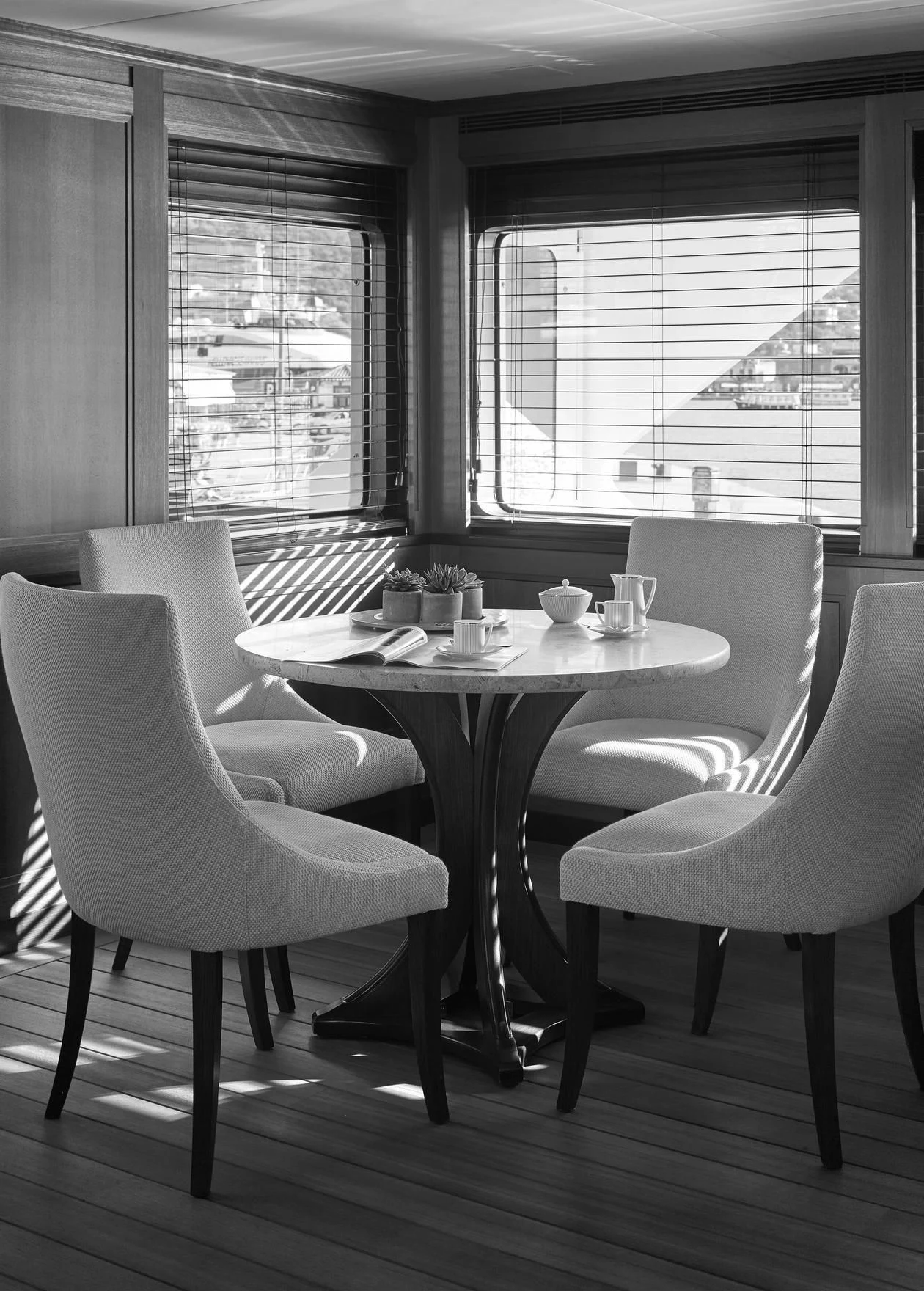 a table with chairs and a window aboard ANCALLIA Yacht for Sale