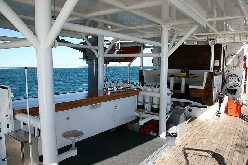 a room with a large window and a view of the water aboard FLAMINGO BAY Yacht for Sale