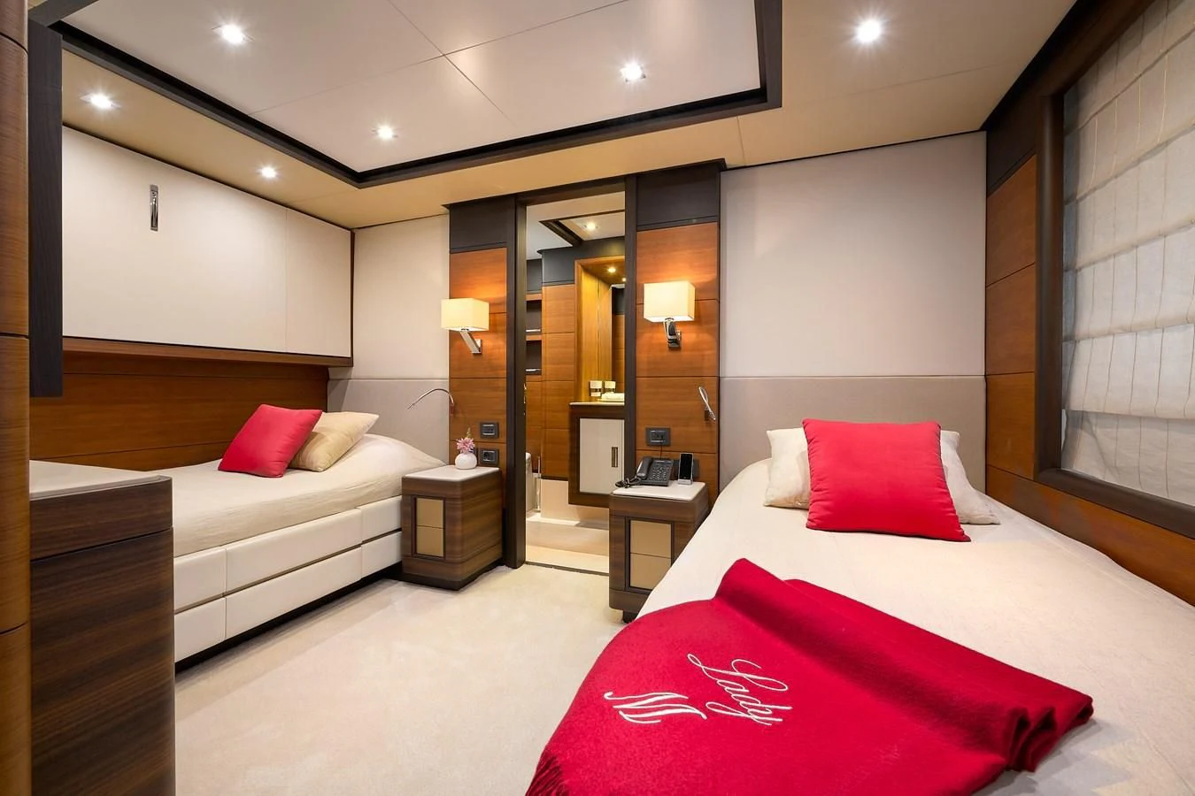 a hotel room with two beds aboard LADY MRD Yacht for Charter