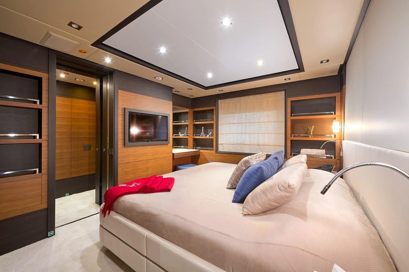 a room with a bed and a tv aboard LADY MRD Yacht for Charter