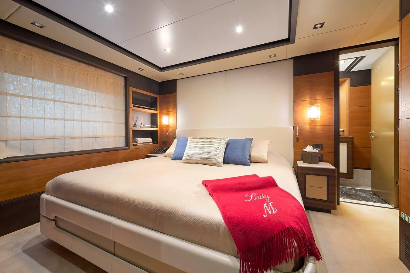 a hotel room with a bed and a window aboard LADY MRD Yacht for Charter