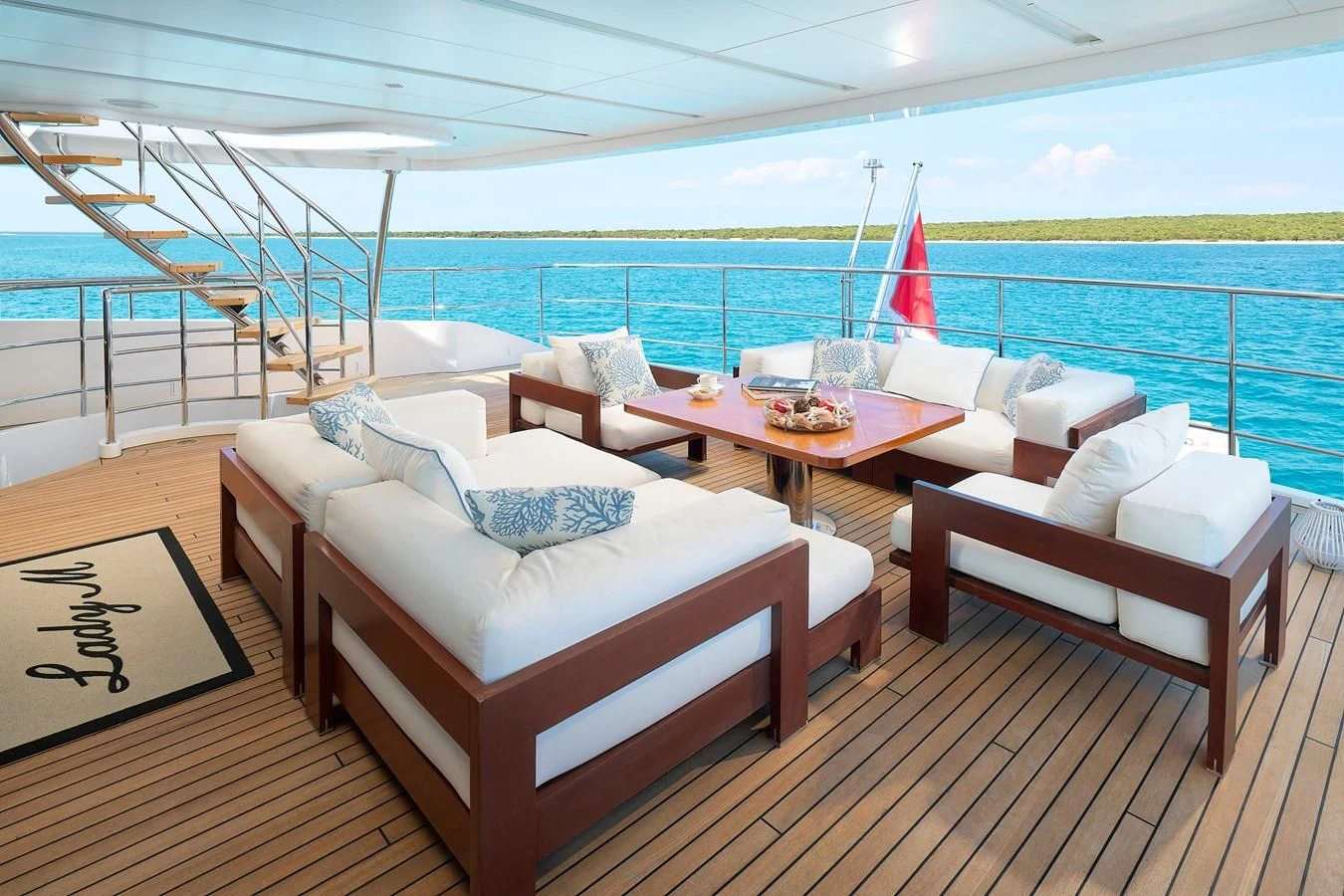 a room with a table chairs and a view of the ocean aboard LADY MRD Yacht for Charter