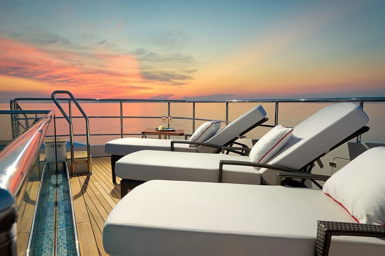 a boat with a deck and chairs aboard LADY MRD Yacht for Charter