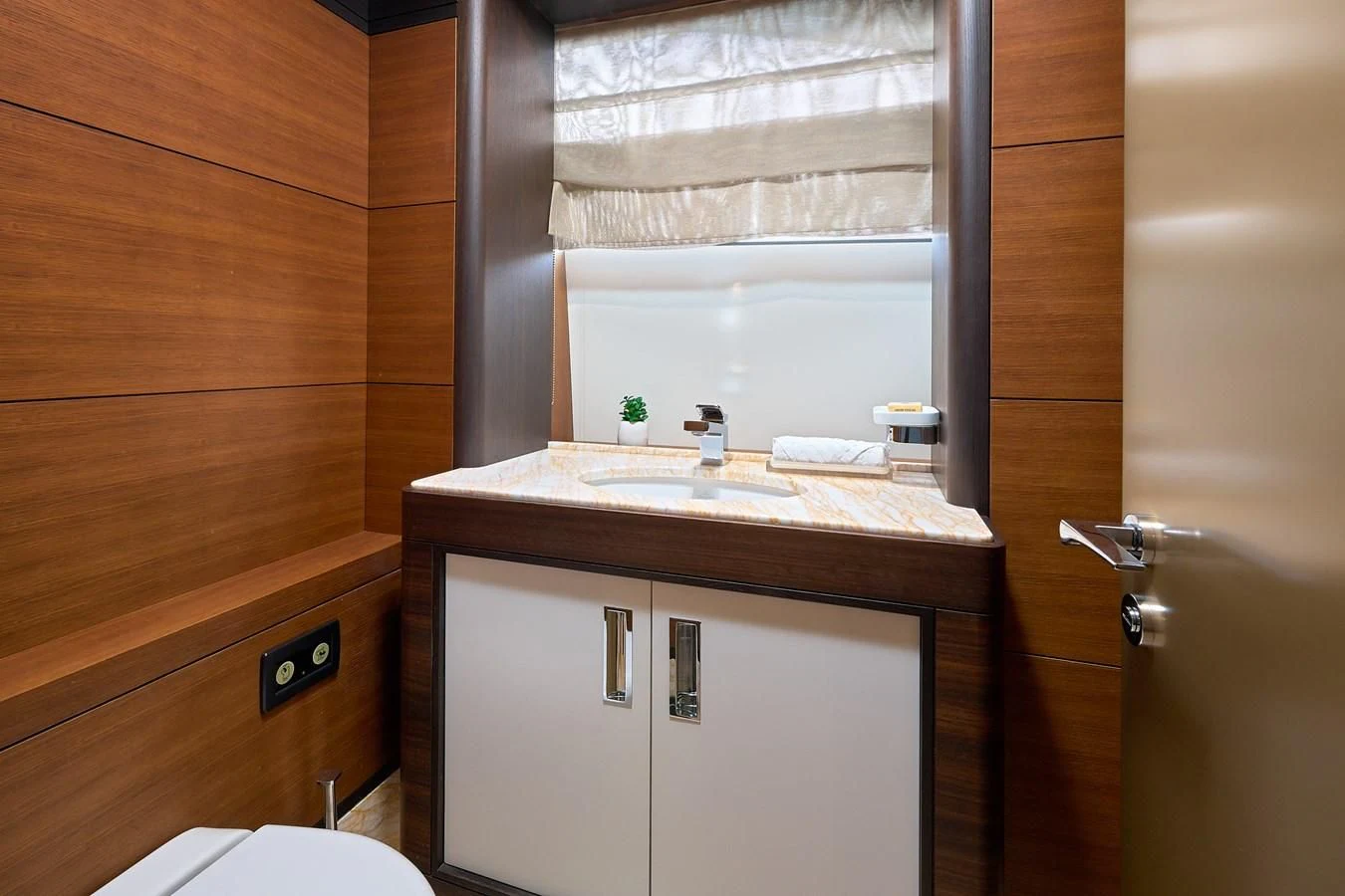 a bathroom with a sink and cabinets aboard LADY MRD Yacht for Charter