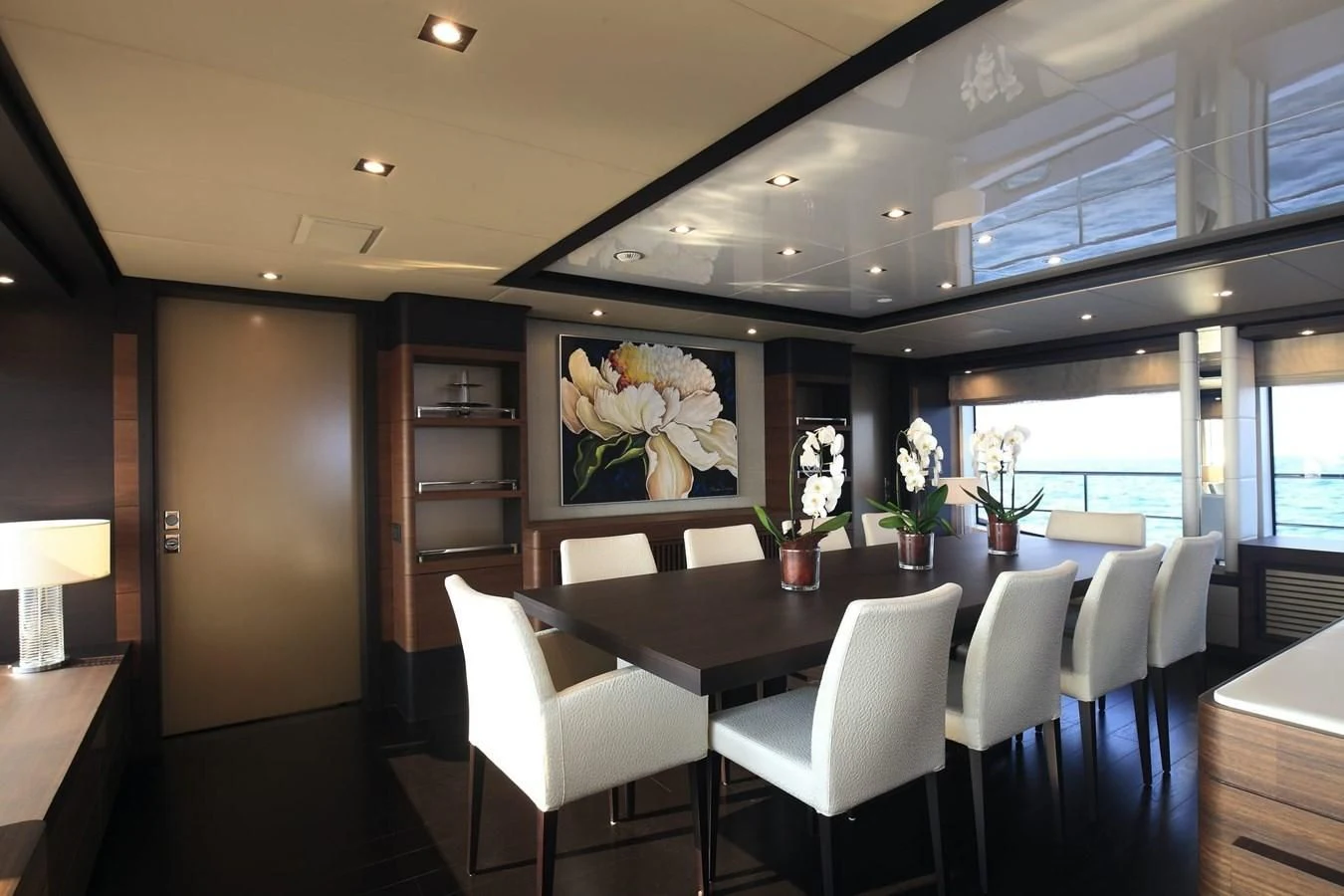 a room with tables and chairs aboard LADY MRD Yacht for Charter