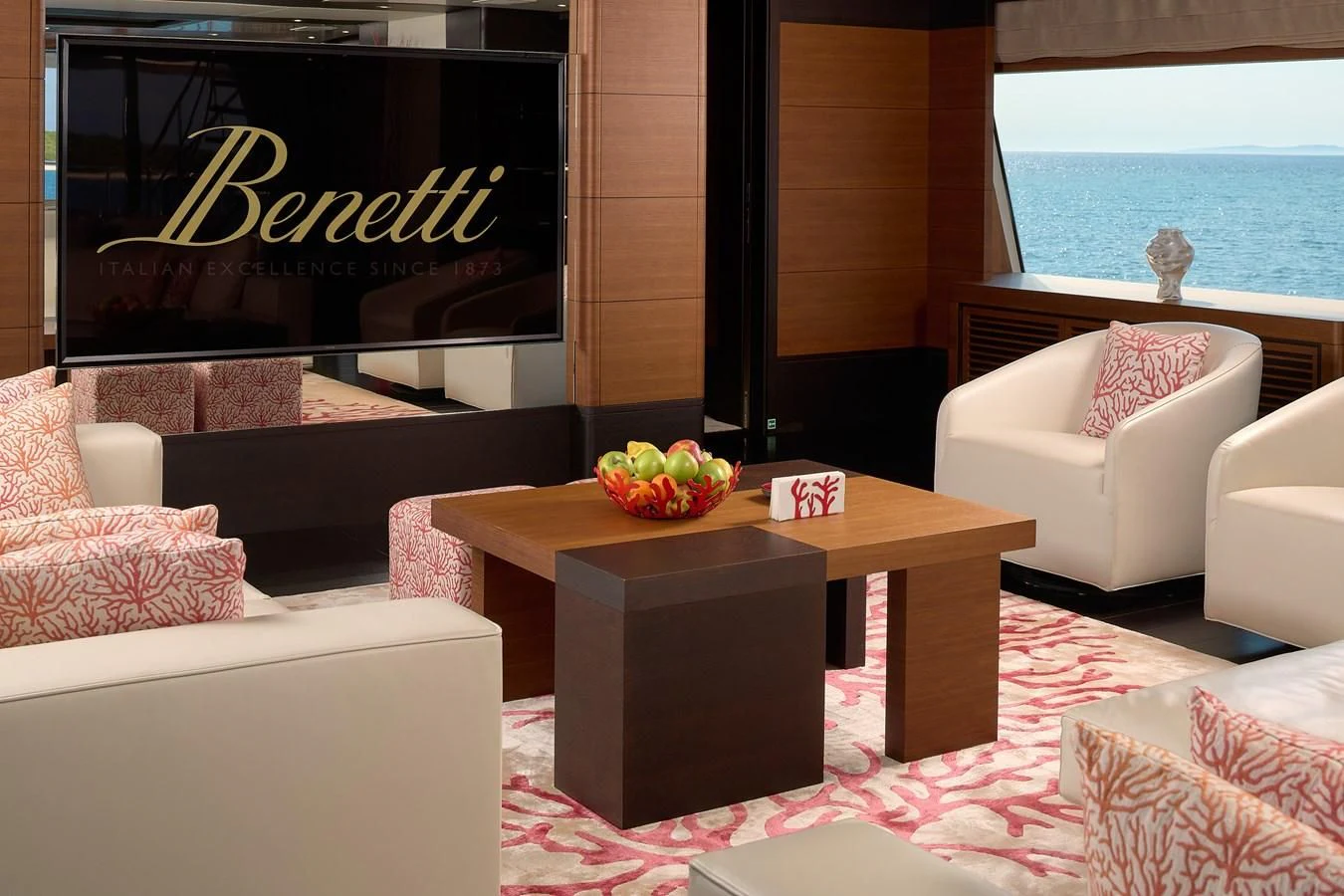 a table with a bowl of fruit on it aboard LADY MRD Yacht for Charter