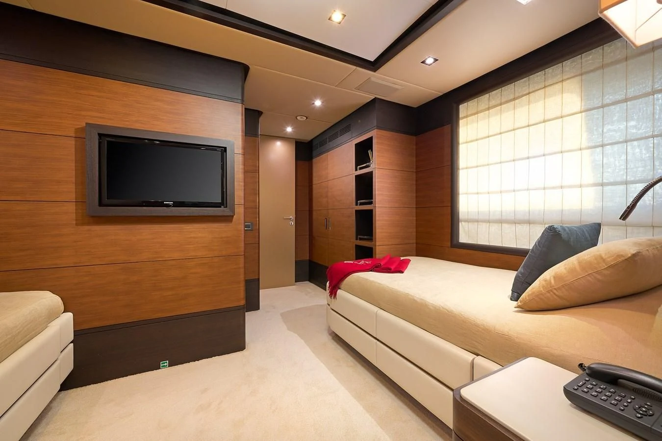 a room with a bed and a tv aboard LADY MRD Yacht for Charter