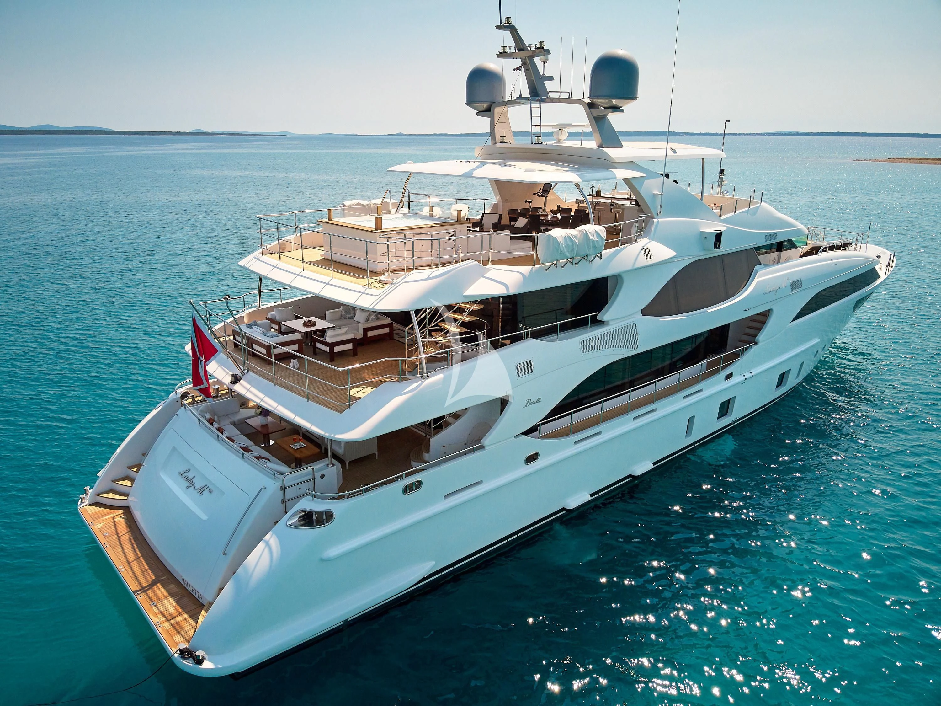 a large white boat in the water aboard LADY MRD Yacht for Charter