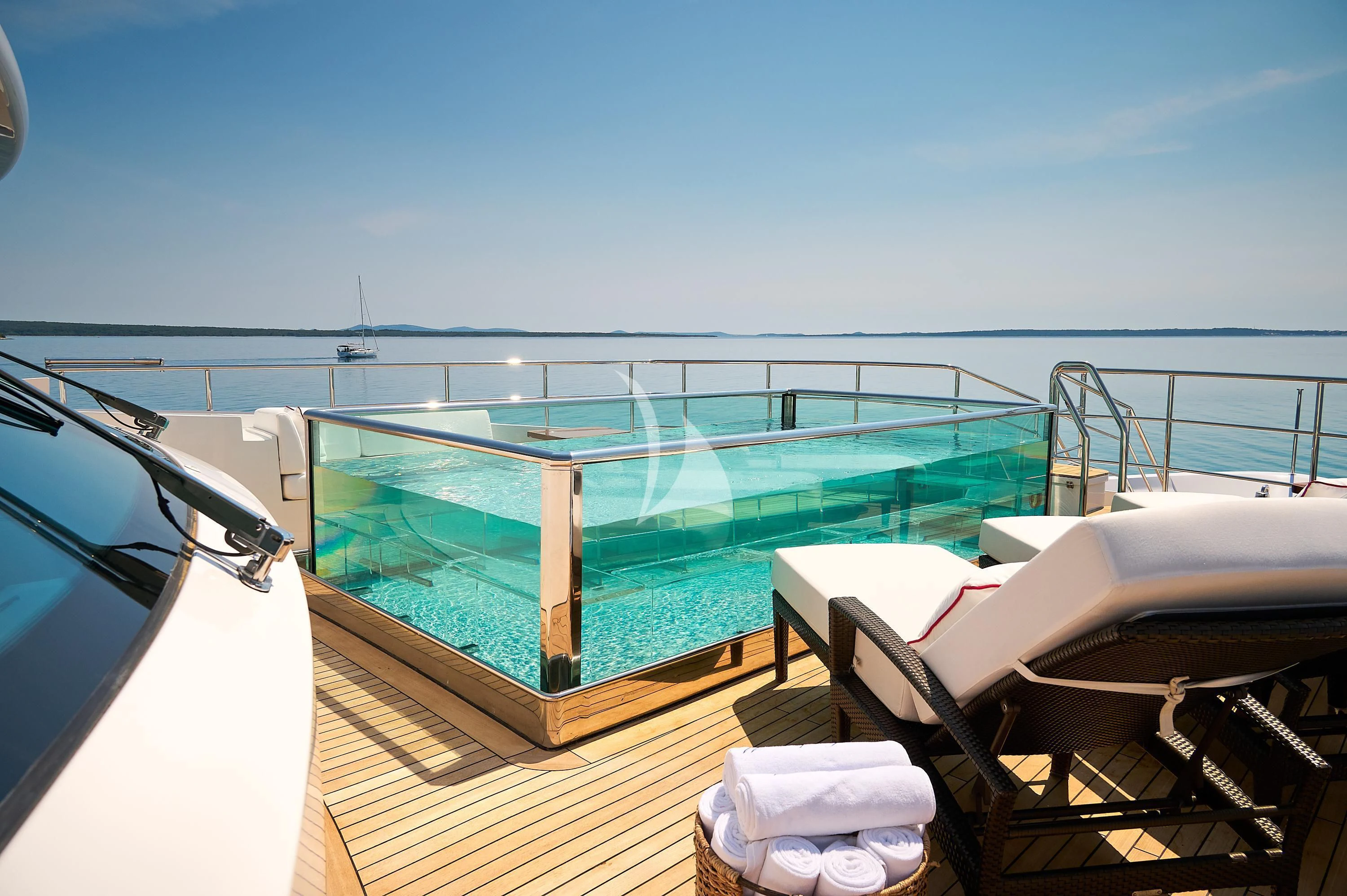 a balcony overlooking a body of water aboard LADY MRD Yacht for Charter