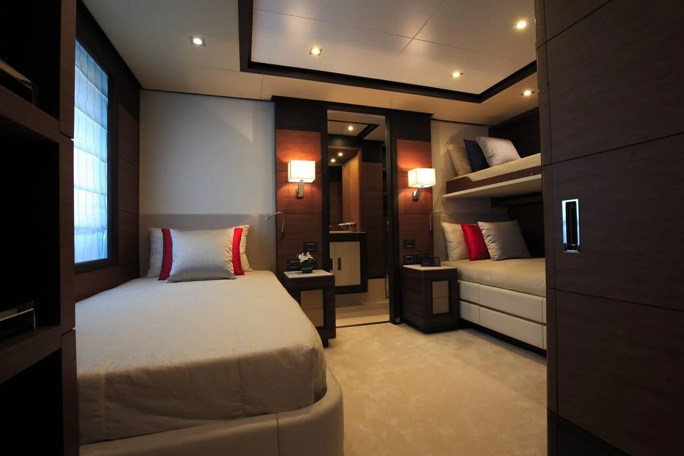 a hotel room with a bed and a desk aboard LADY MRD Yacht for Charter