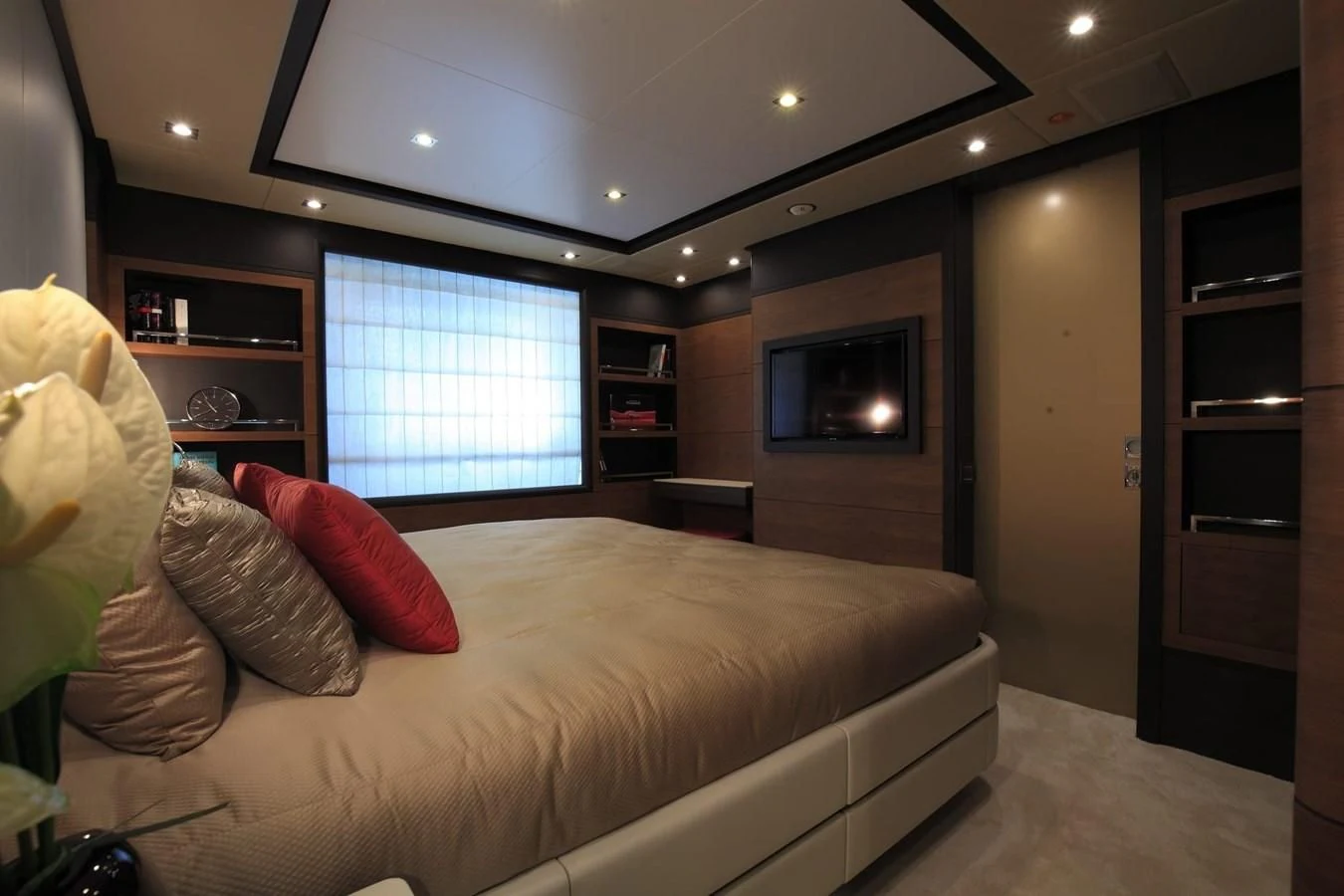 a living room with a couch and a tv aboard LADY MRD Yacht for Charter
