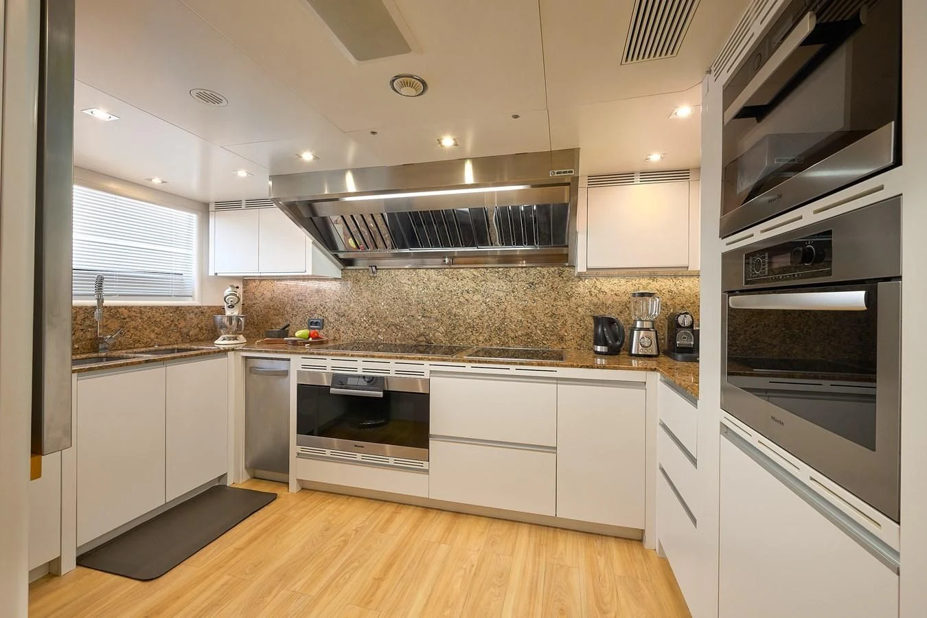 a kitchen with white cabinets aboard LADY MRD Yacht for Charter